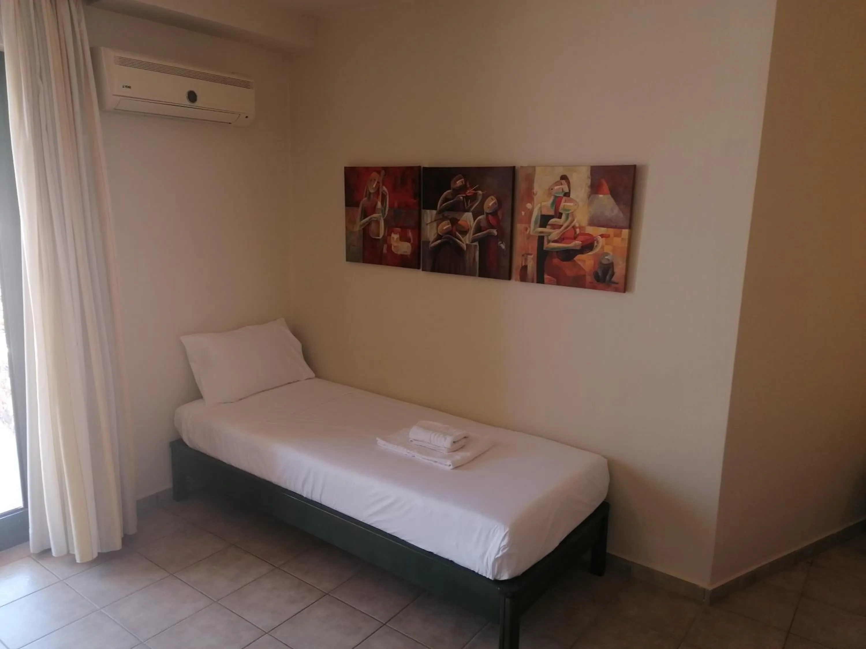 Bed in Villiana Holiday Apartments