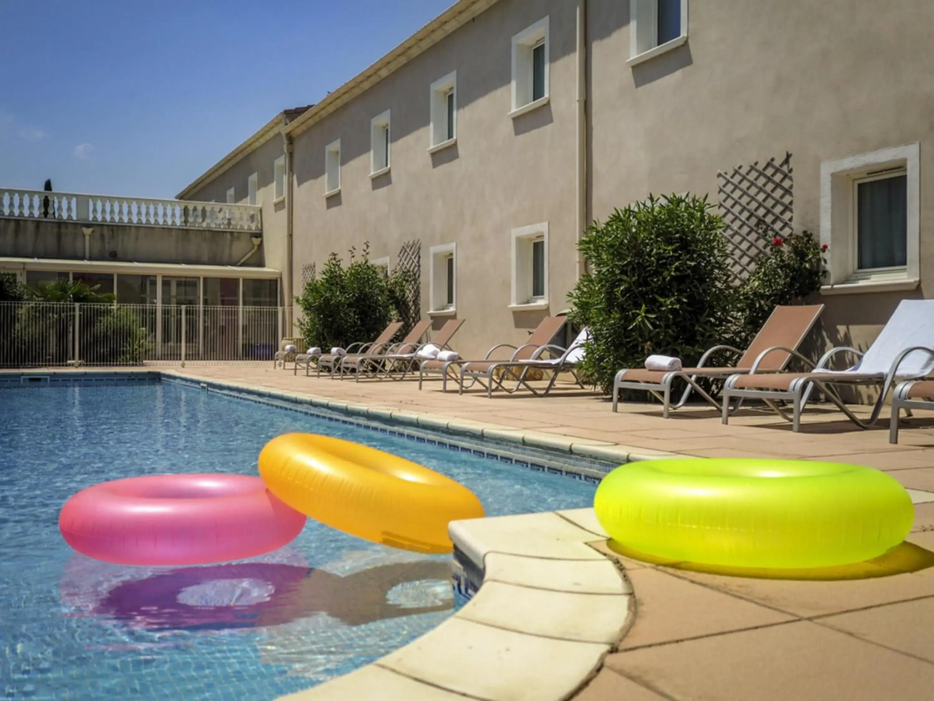 Pool view in ibis Orange Sud Pool view in ibis Orange Sud