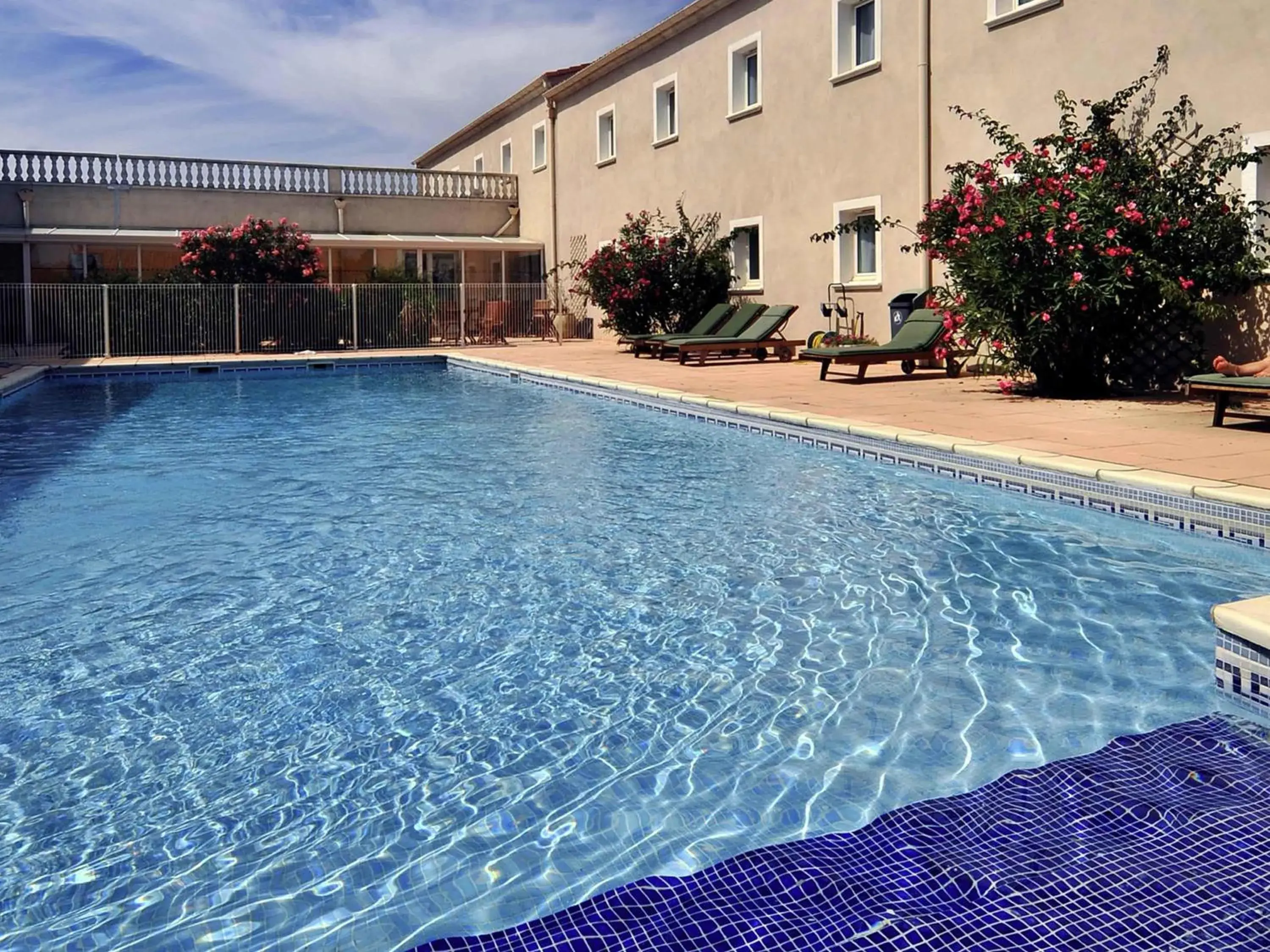 Pool view in ibis Orange Sud Pool view in ibis Orange Sud