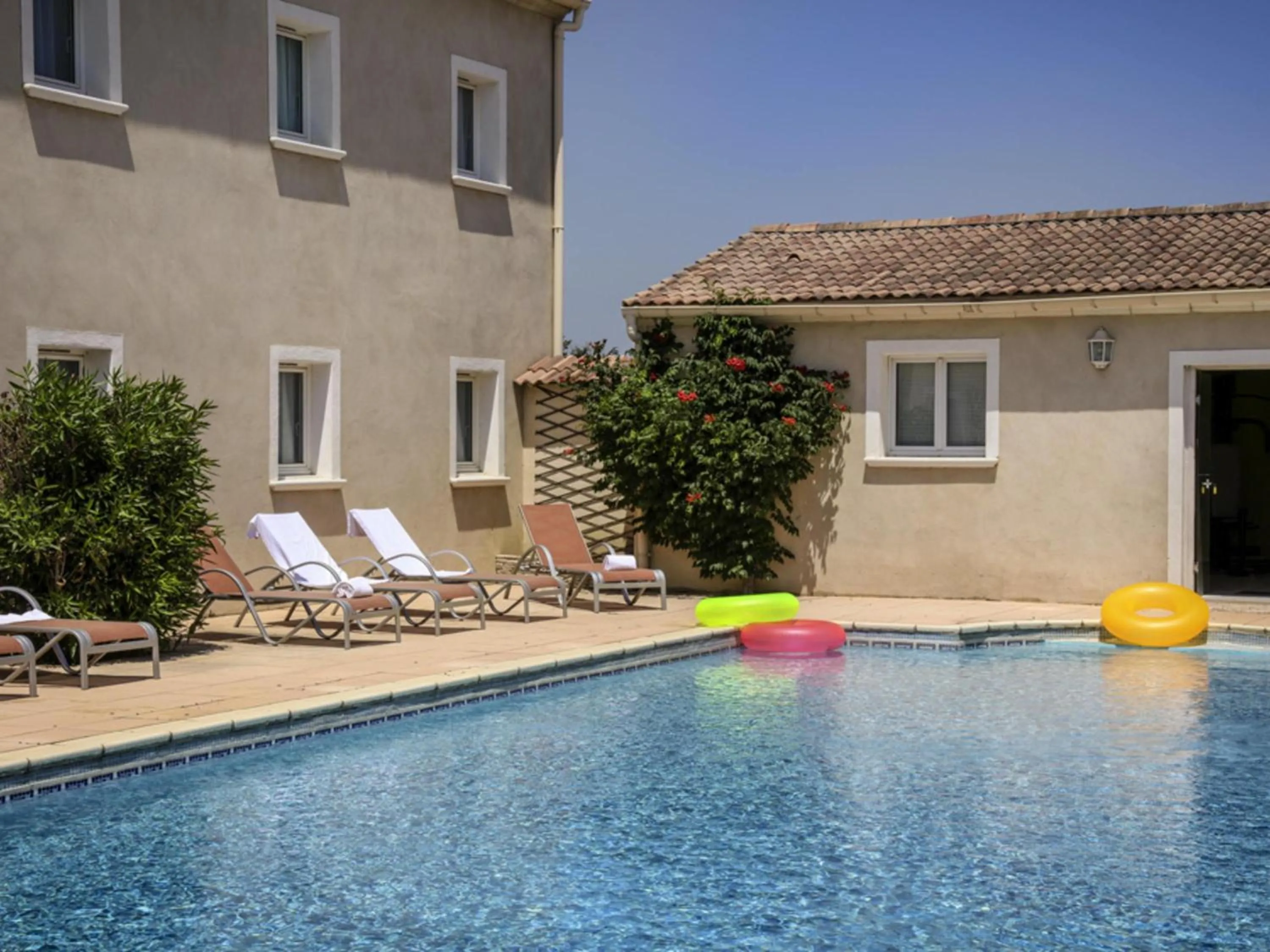 Pool view in ibis Orange Sud