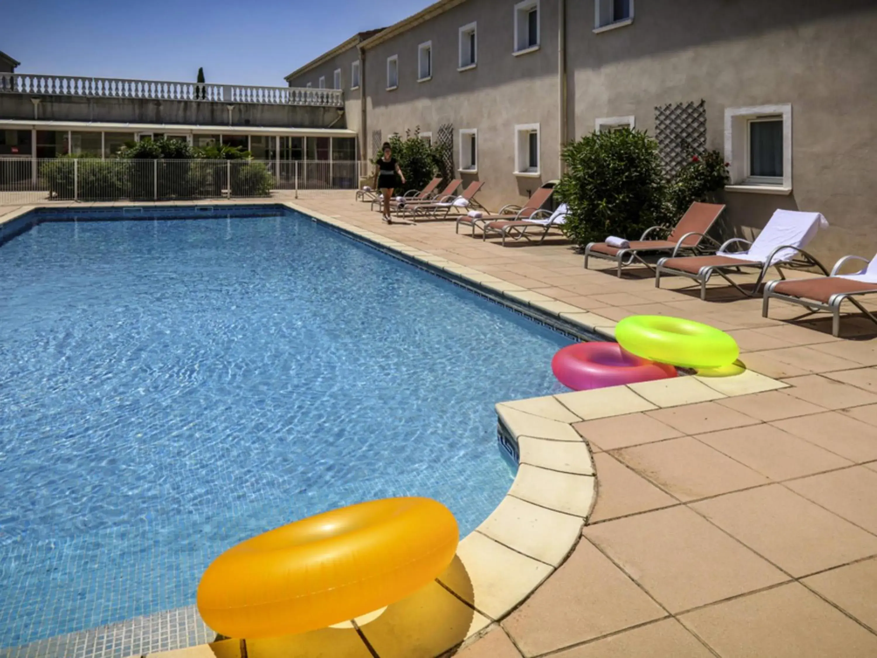 Pool view in ibis Orange Sud Pool view in ibis Orange Sud