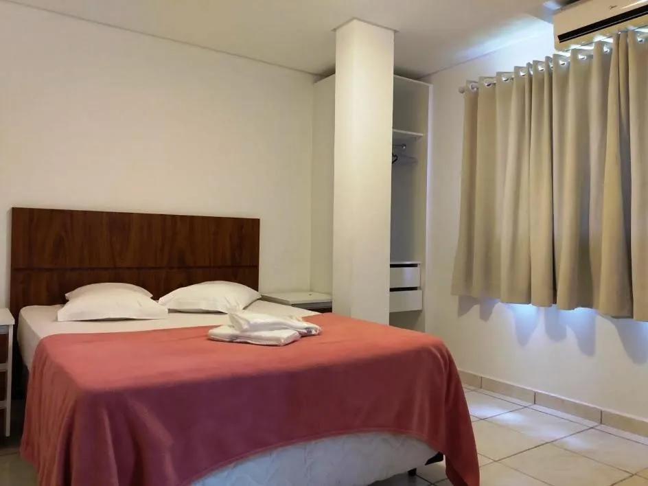 Bed in Pousada Chácara Rio Jordão