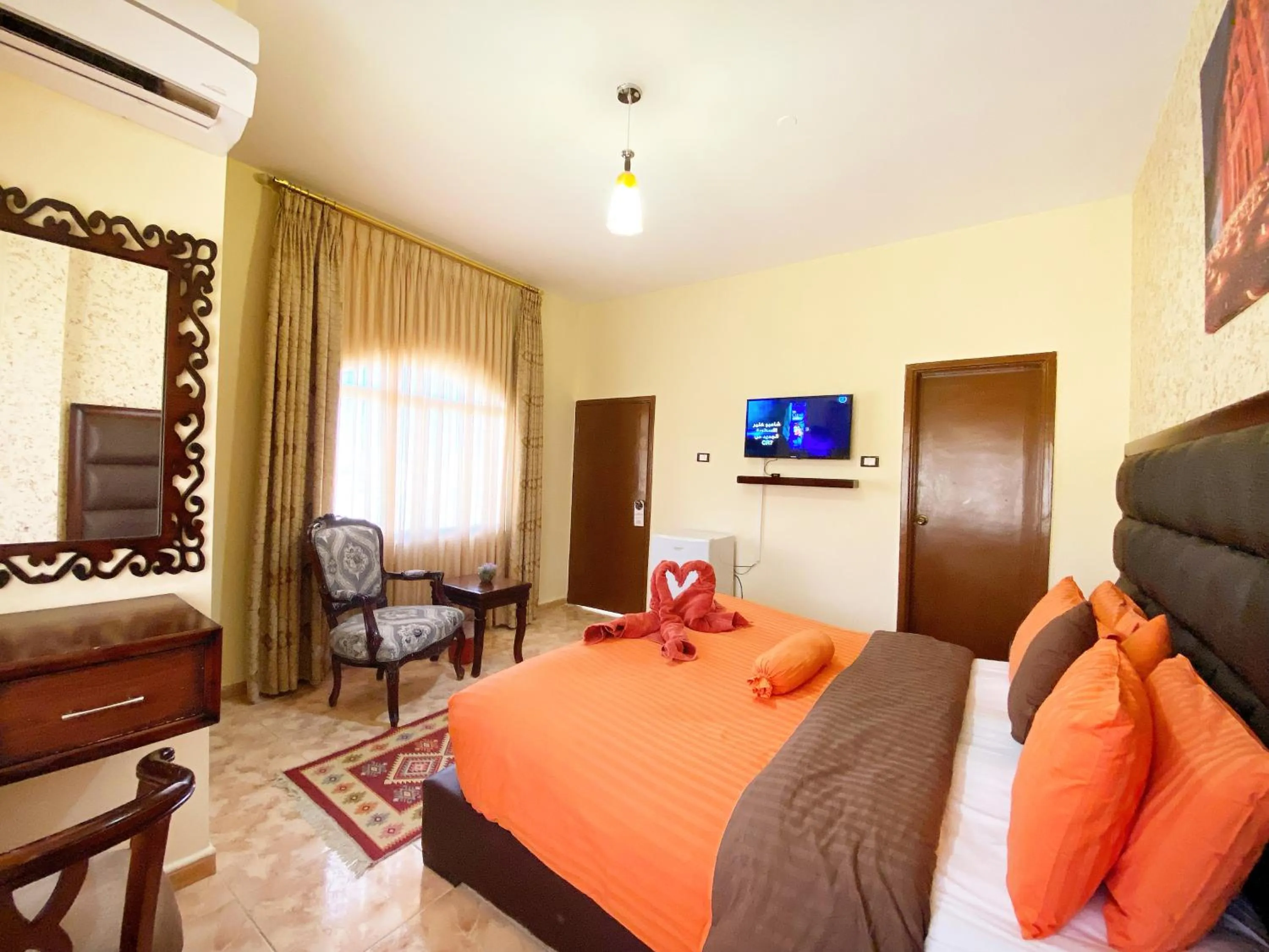 Communal lounge/ TV room, Bed in Anbat Midtown Hotel