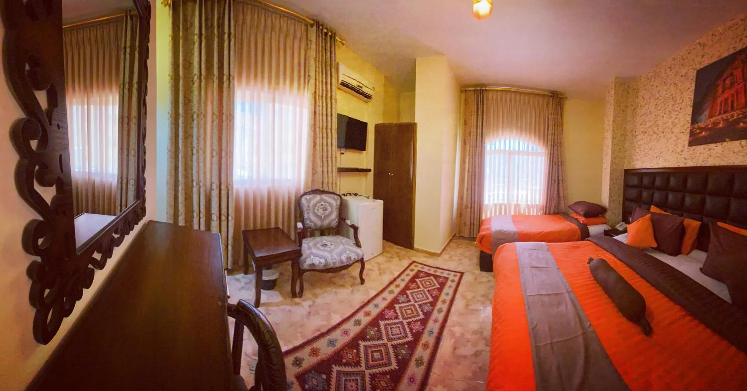 Communal lounge/ TV room, Bed in Anbat Midtown Hotel