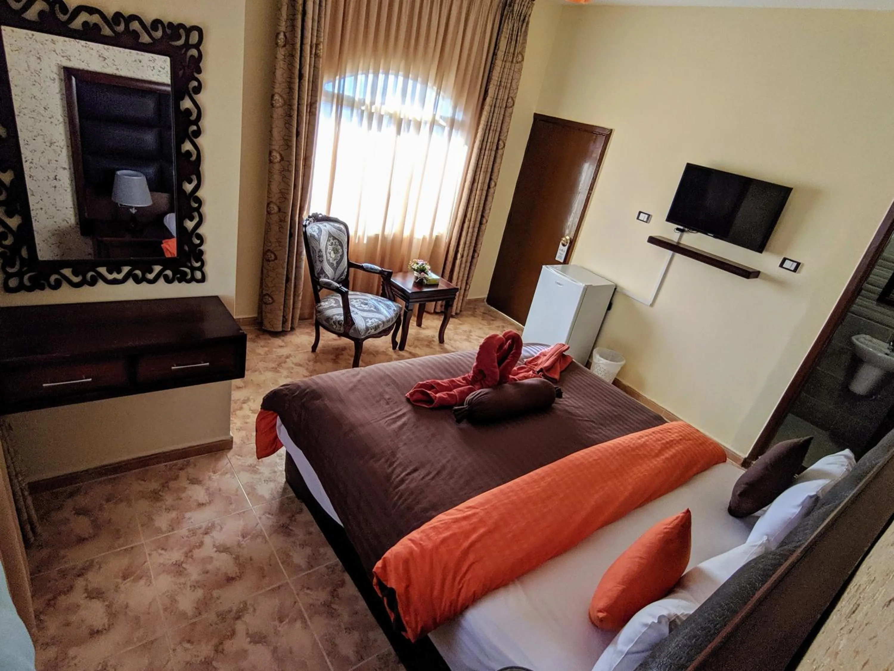 Communal lounge/ TV room, Bed in Anbat Midtown Hotel