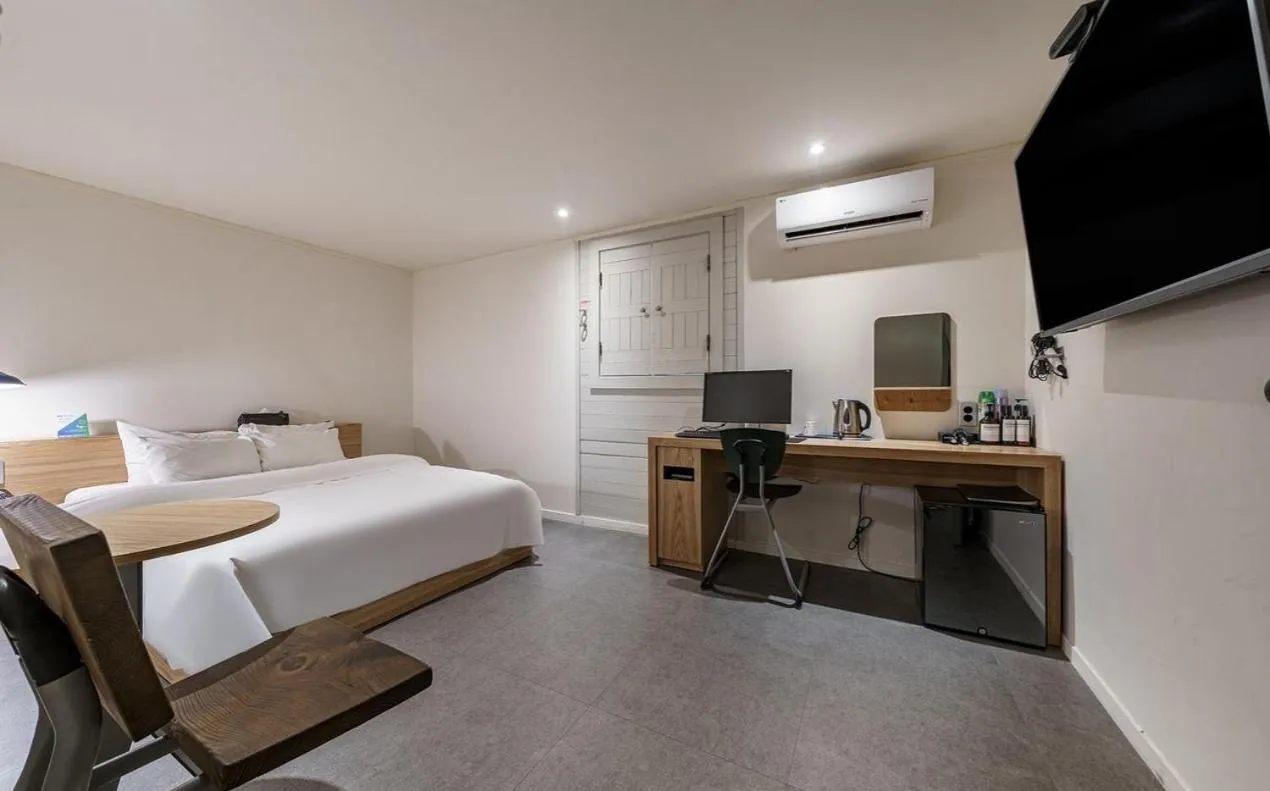 Bed in HOTEL YaJa WestGate