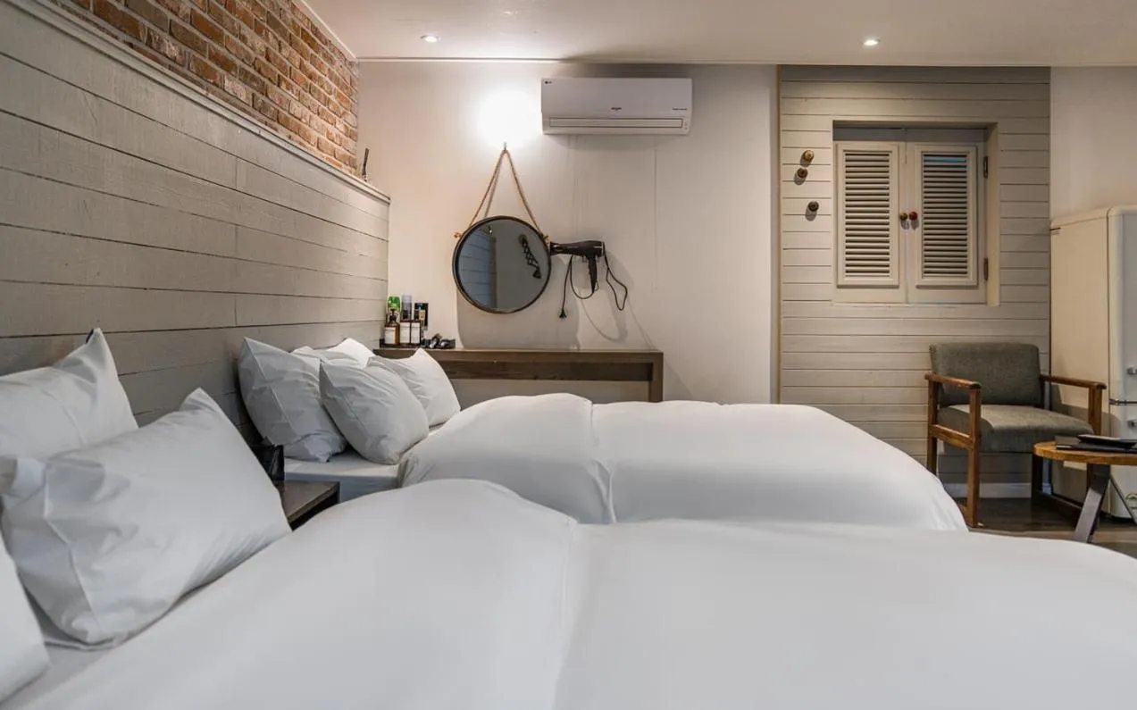 Bed in HOTEL YaJa WestGate