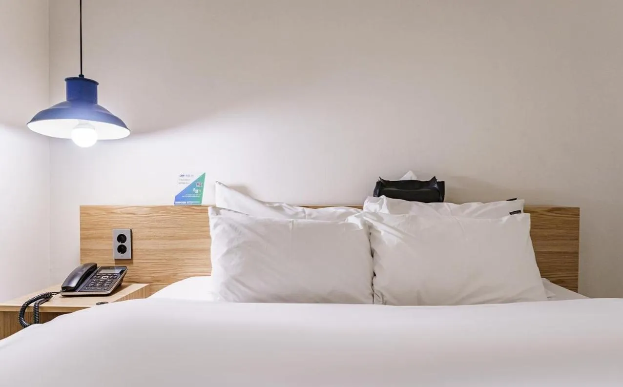 Bed in HOTEL YaJa WestGate