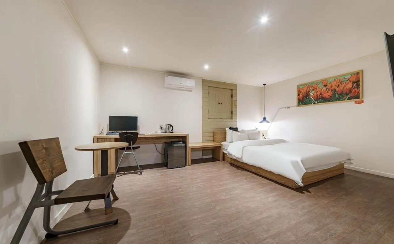 Bed in HOTEL YaJa WestGate