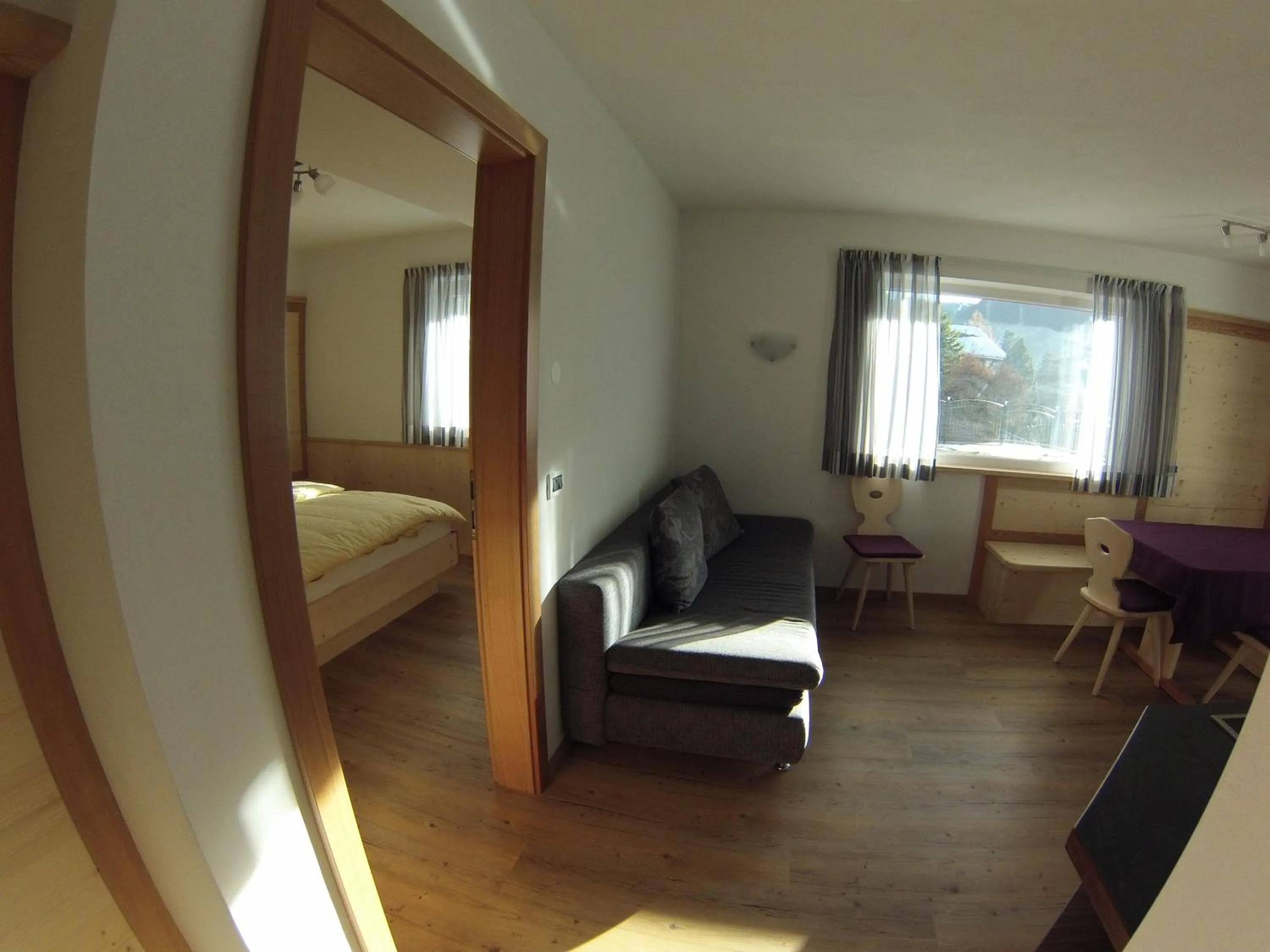 Living room, Bed in Villa Hubertus