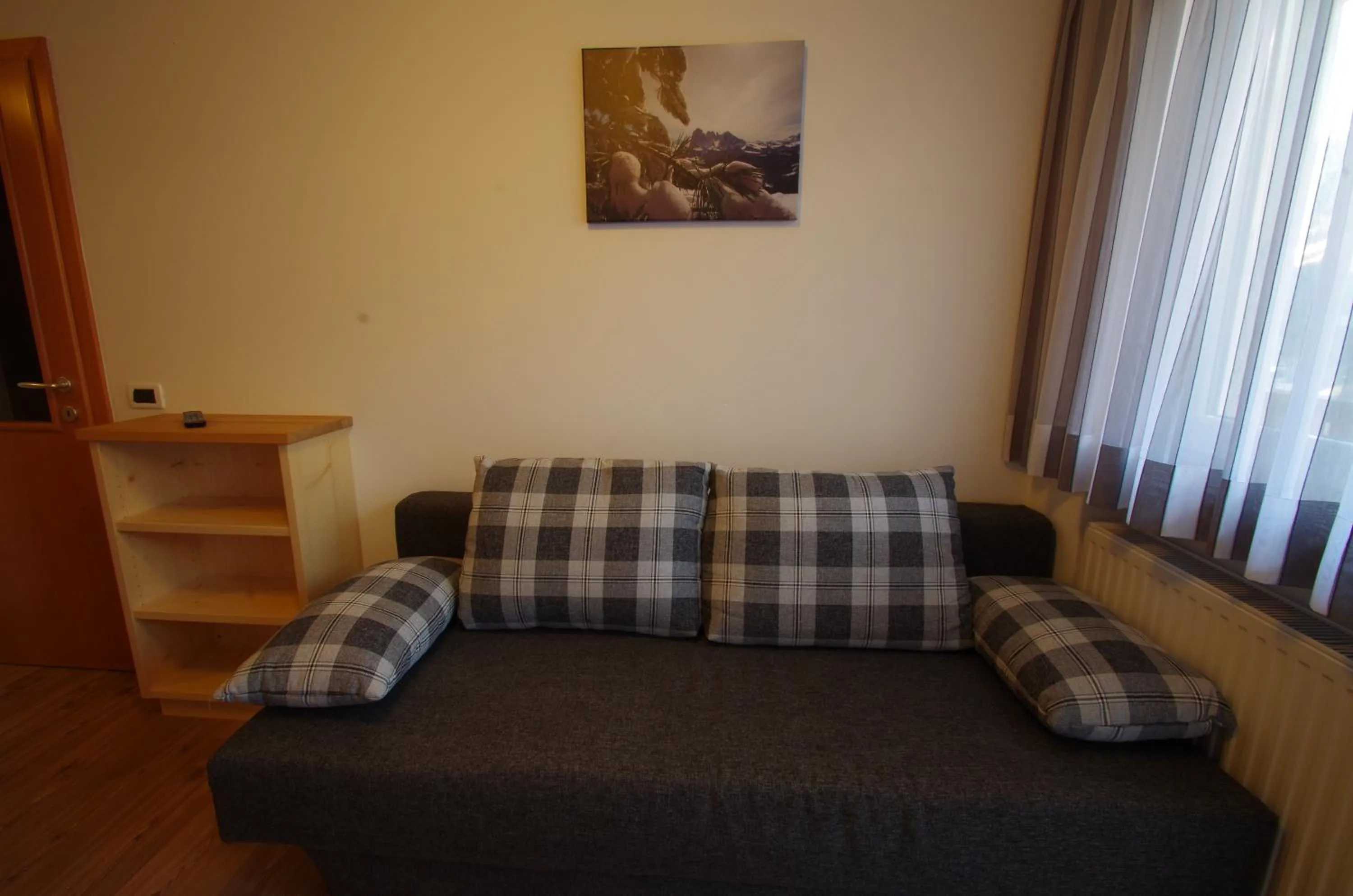 Living room, Bed in Villa Hubertus
