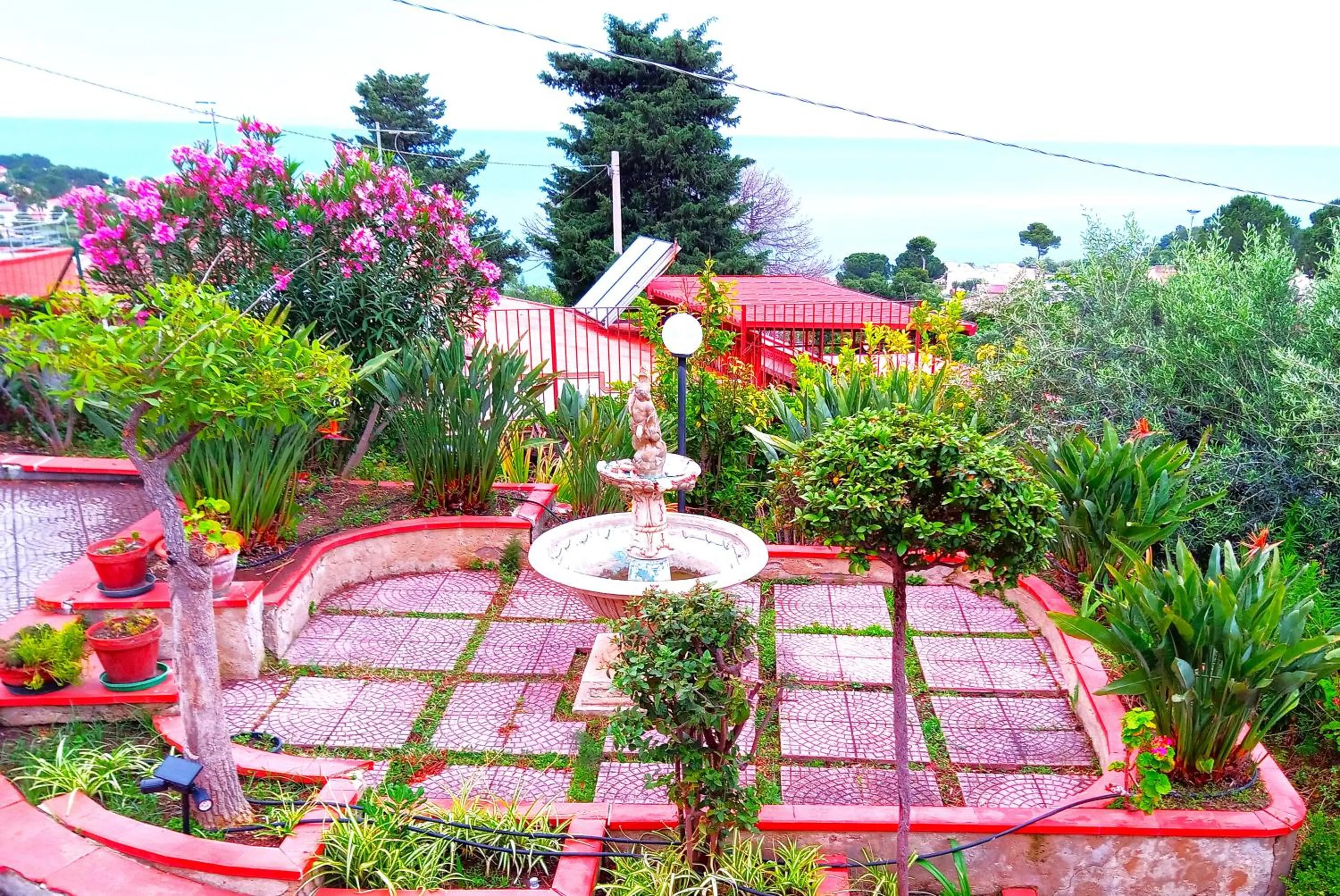 Garden in Stanza in Villa con giardino vista mare