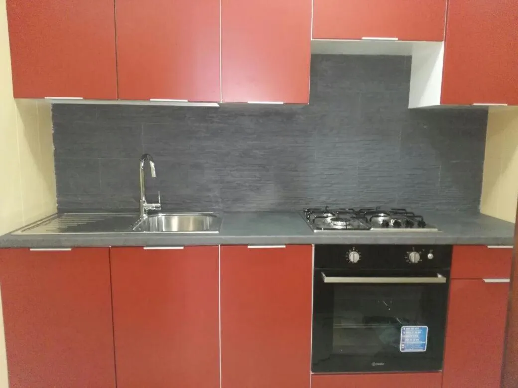 Kitchen or kitchenette in Stanza in Villa con giardino vista mare