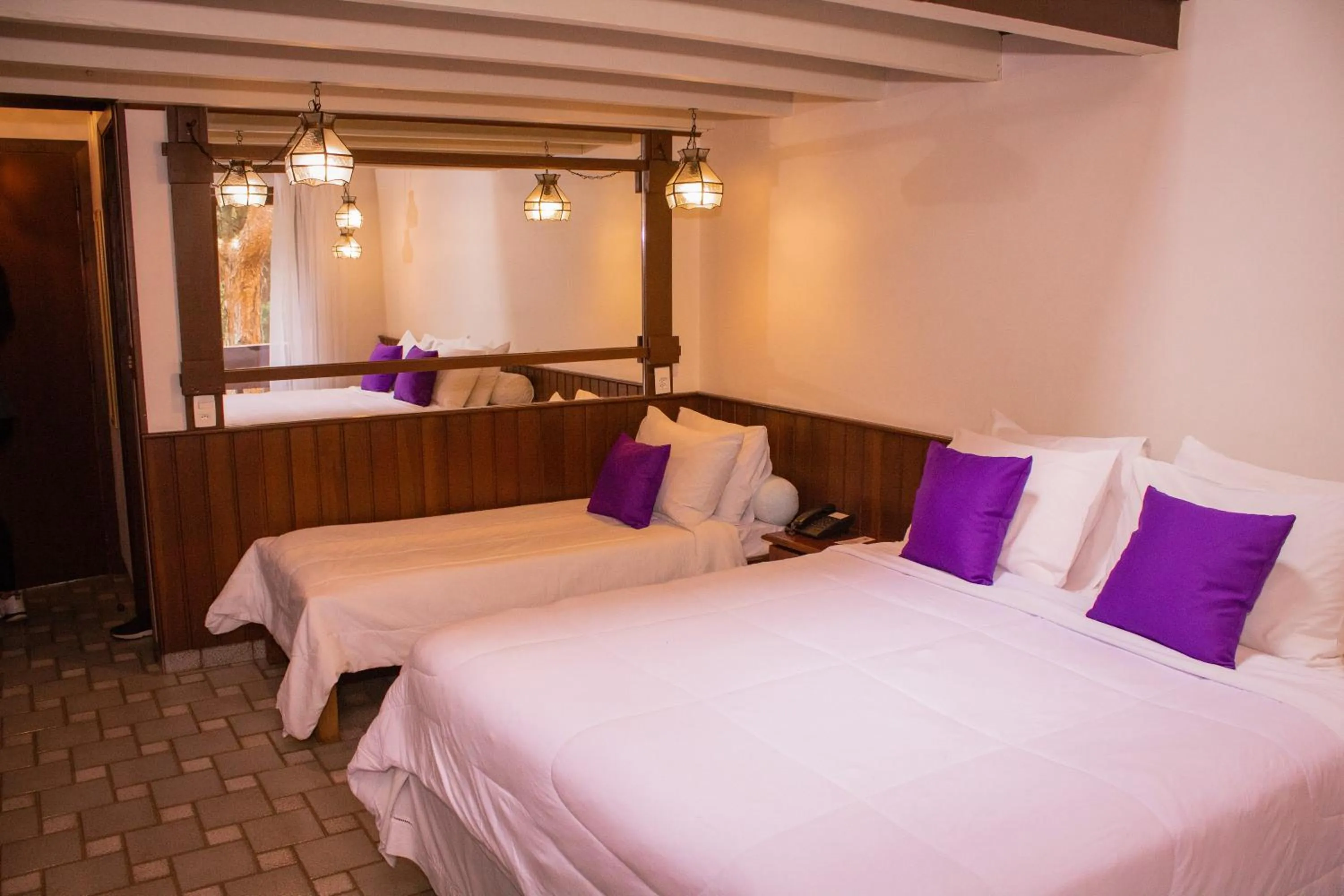 Bed in Pousada O Cantinho da Raposa