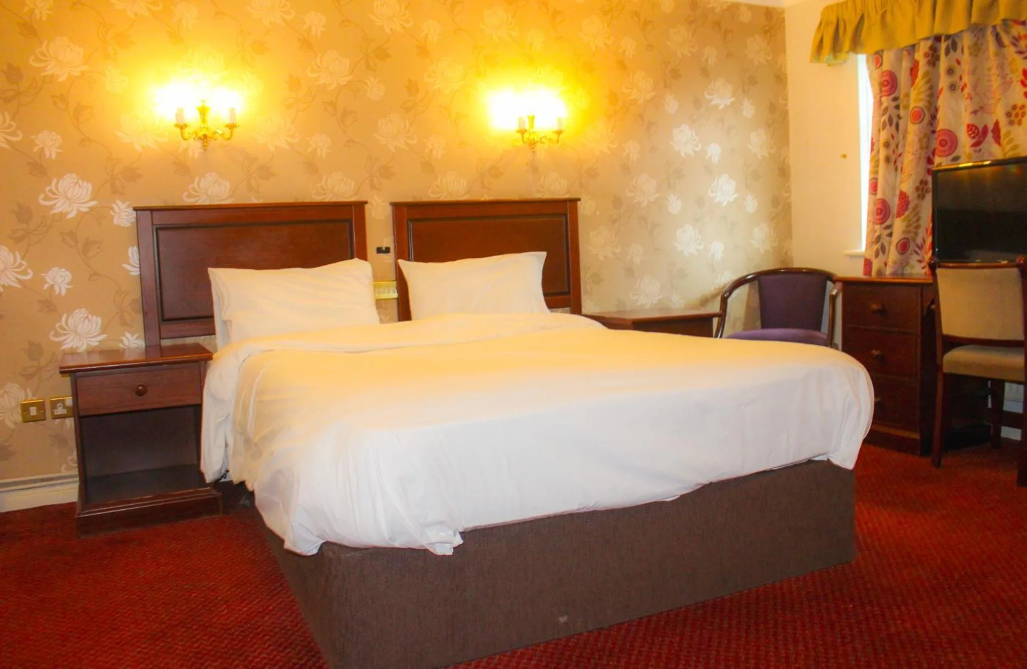 Deluxe Quadruple Room - single occupancy in Consort Hotel