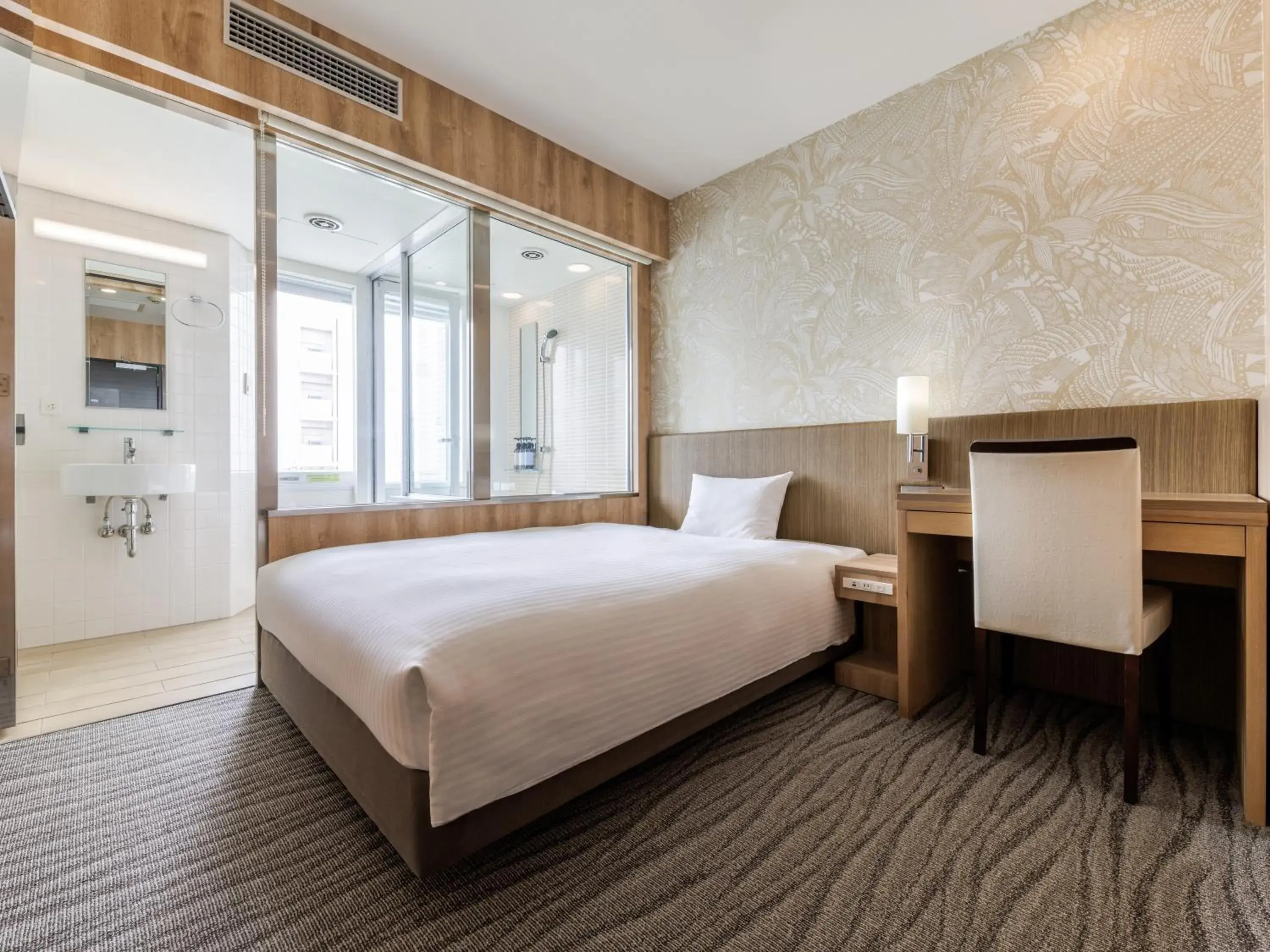 Bed in Nishitetsu Resort Inn Naha Bed in Nishitetsu Resort Inn Naha