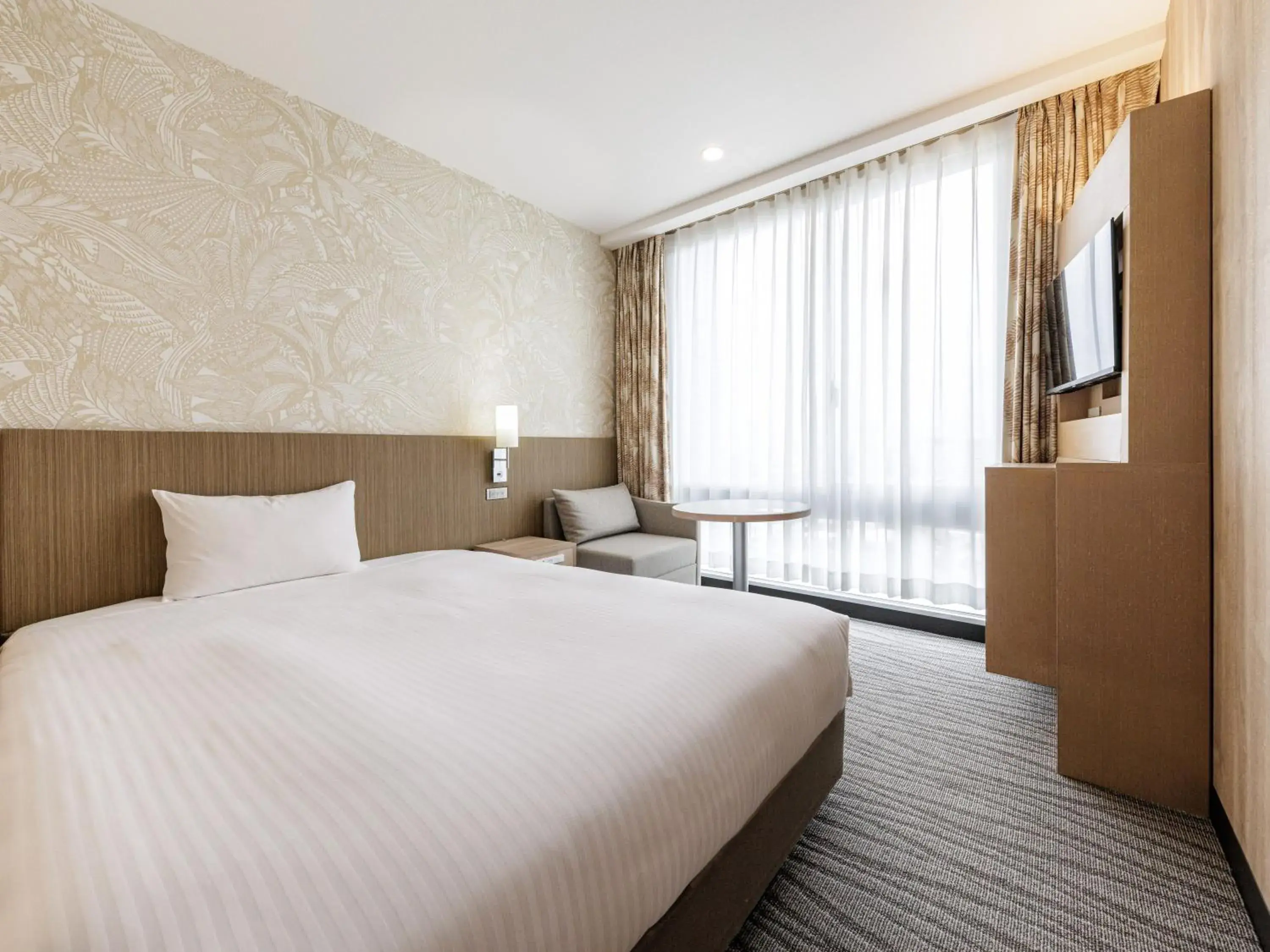 Bed in Nishitetsu Resort Inn Naha Bed in Nishitetsu Resort Inn Naha