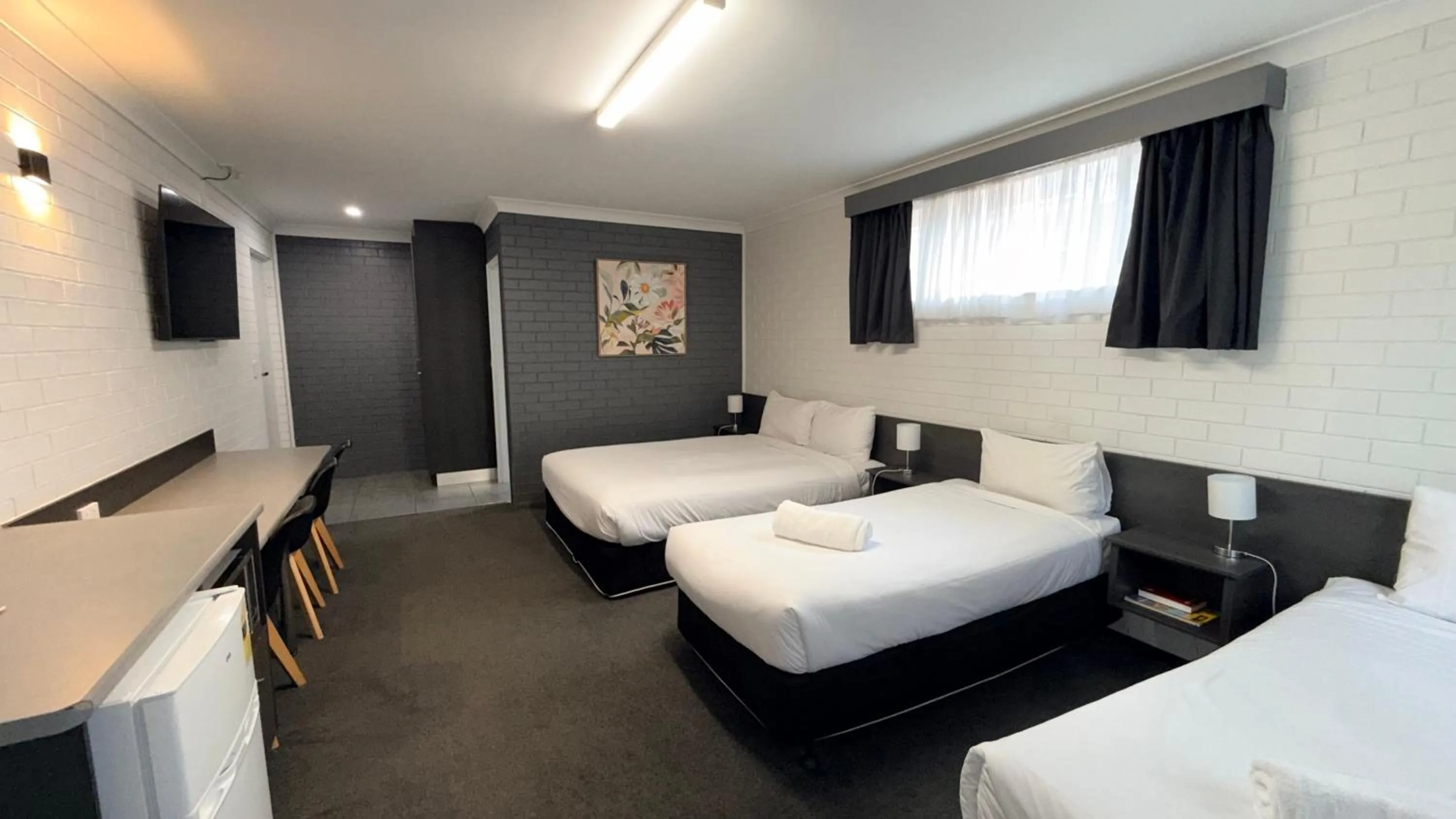 Bed in Blue Violet Motor Inn