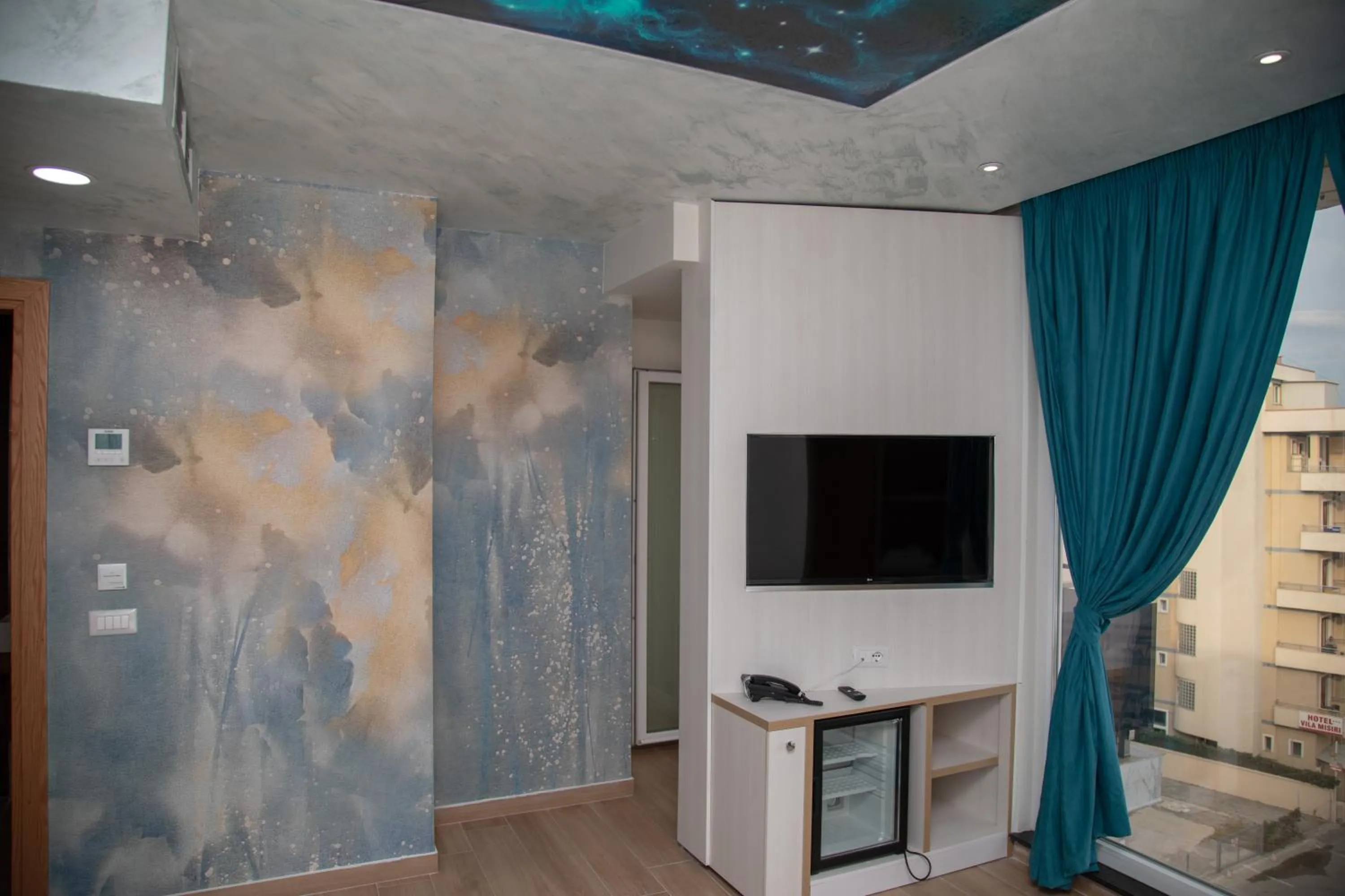 TV and multimedia in Vila One Beach Hotel