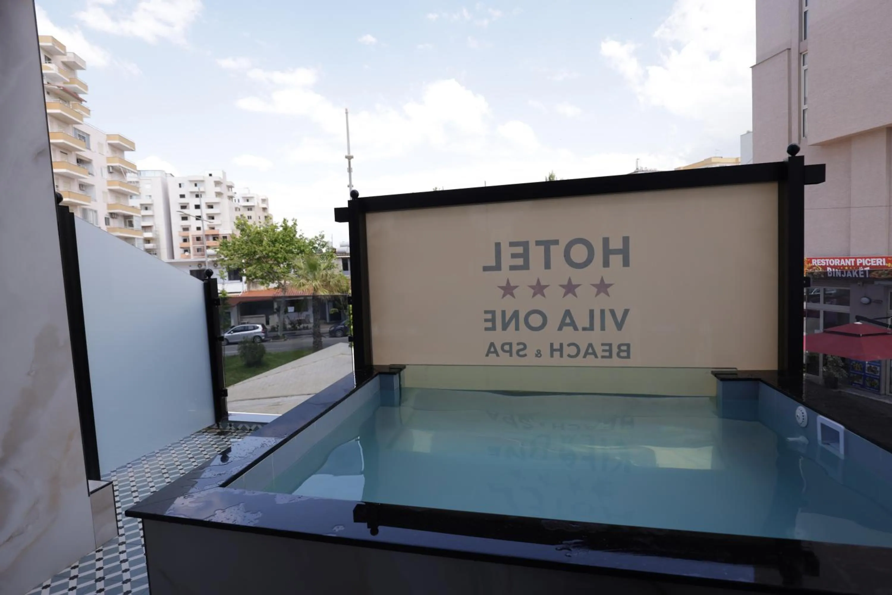 Text overlay in Vila One Beach Hotel