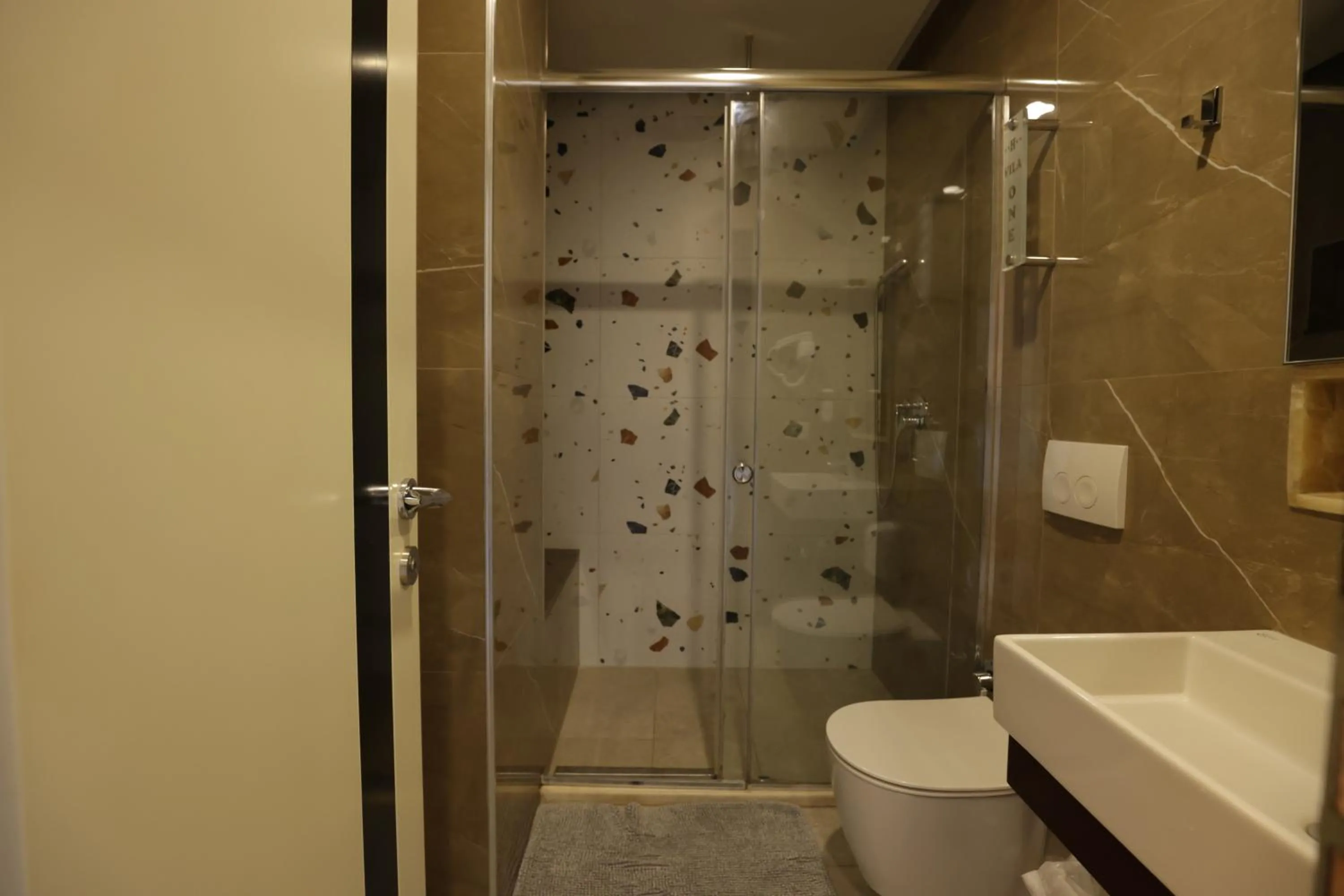 Toilet in Vila One Beach Hotel