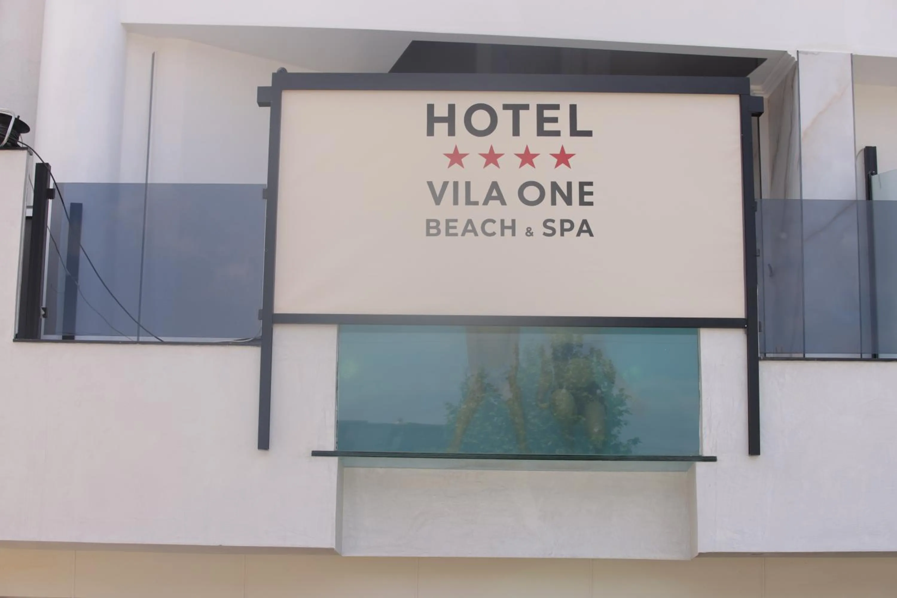 Property logo or sign in Vila One Beach Hotel