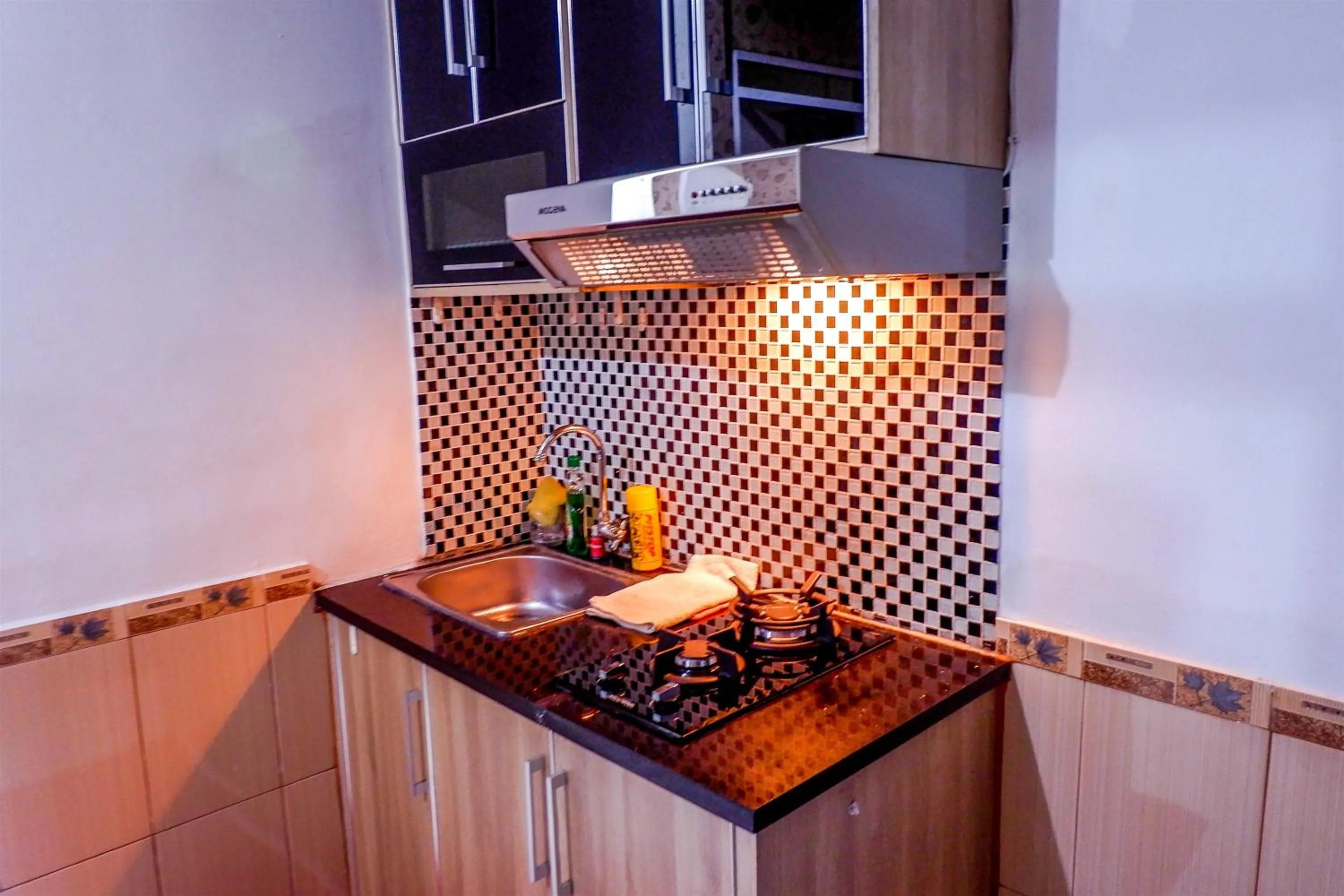 Kitchen or kitchenette in Strategic 2BR Menteng Square Apartment By Travelio