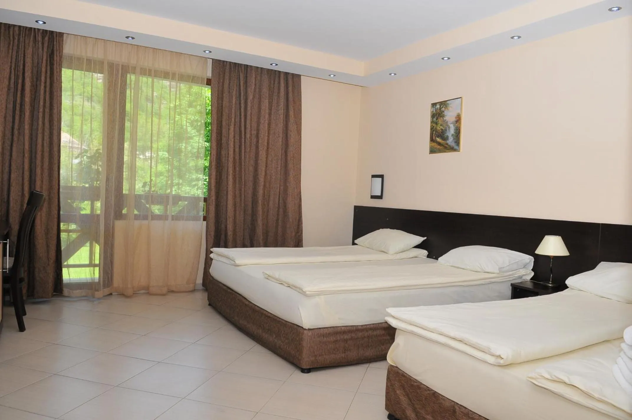 Bed in Family Hotel Delta