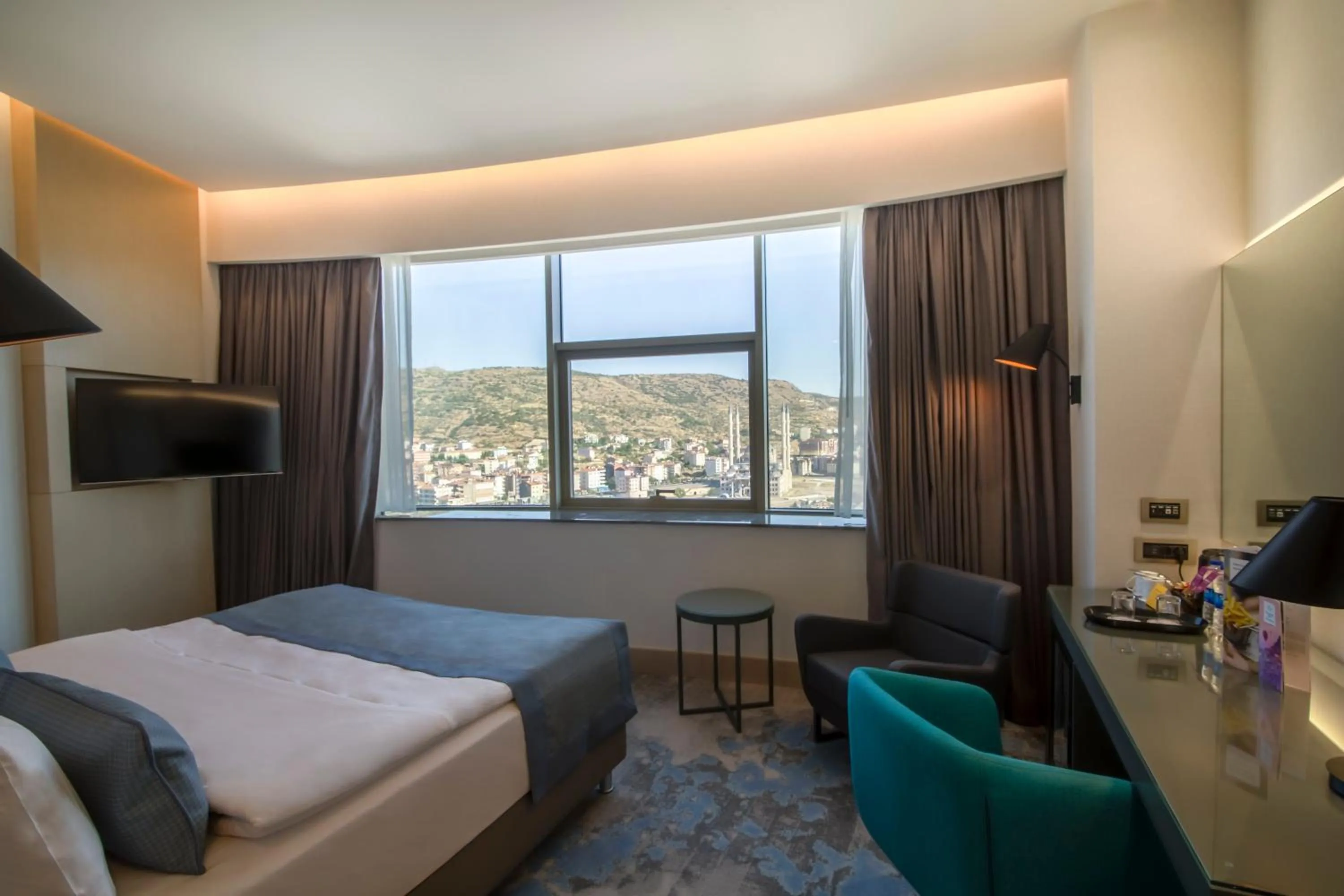 Photo of the whole room, Bed in Crowne Plaza Cappadocia - Nevsehir by IHG