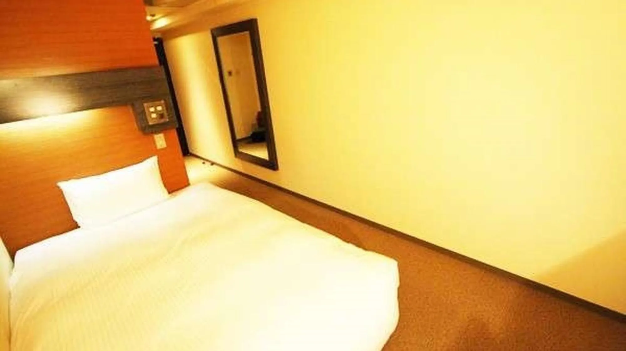Bed in Green Rich Hotel Nishitetsu Ohashi Ekimae