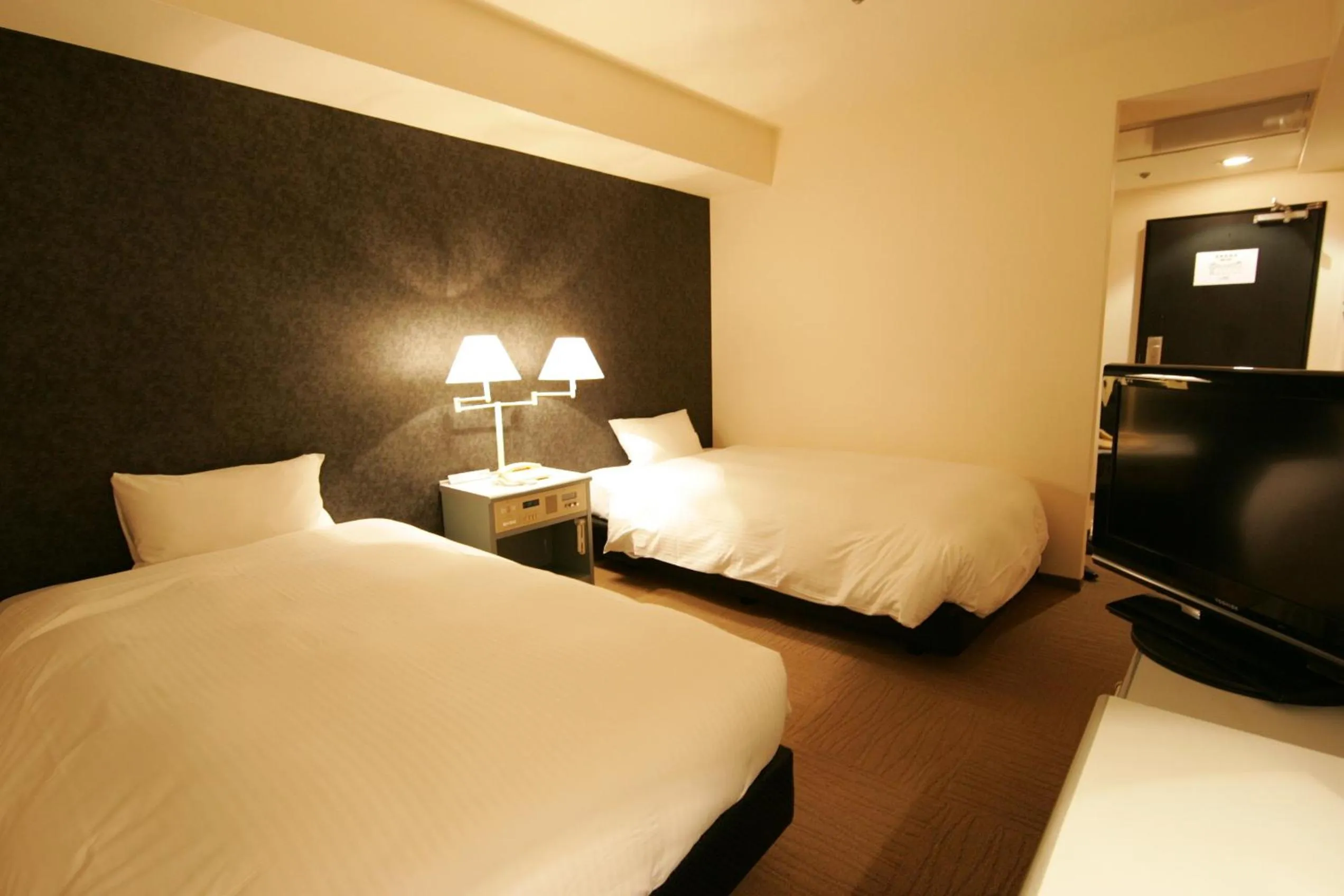 Photo of the whole room, Bed in Green Rich Hotel Nishitetsu Ohashi Ekimae