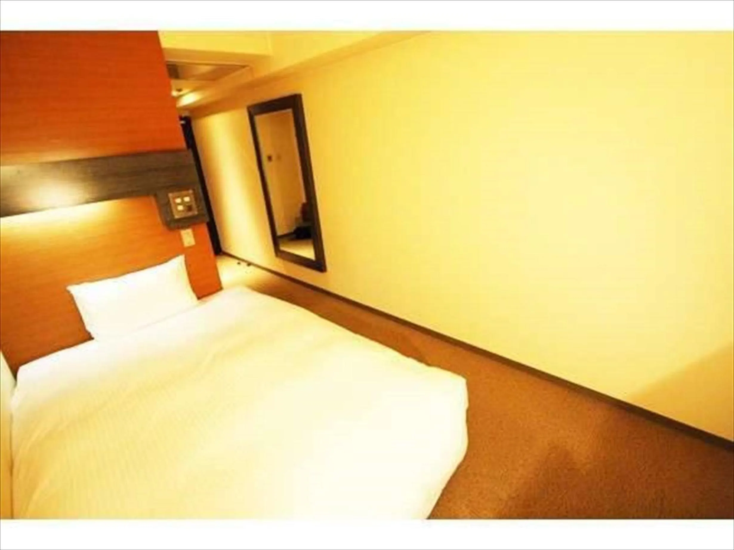 Photo of the whole room, Bed in Green Rich Hotel Nishitetsu Ohashi Ekimae