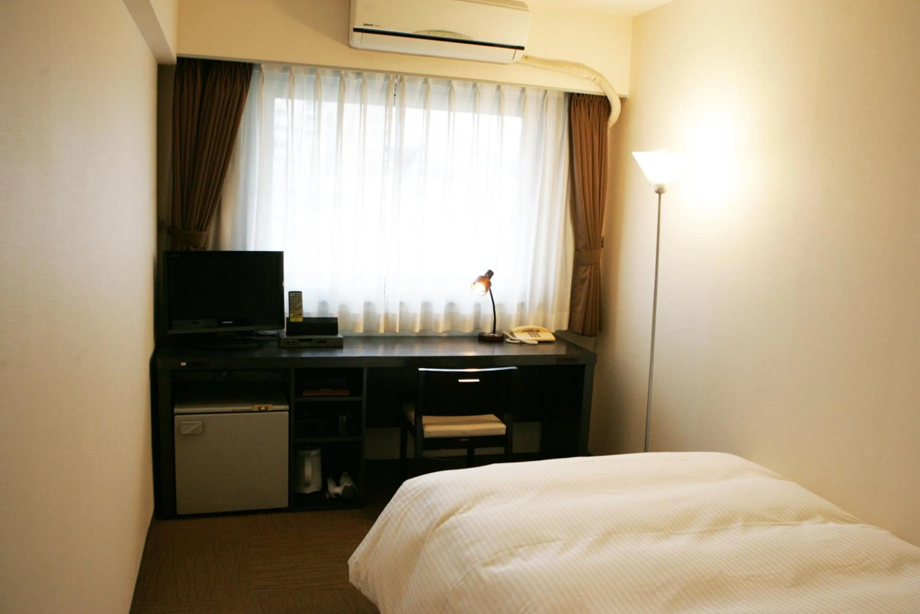 Photo of the whole room, Bed in Green Rich Hotel Nishitetsu Ohashi Ekimae
