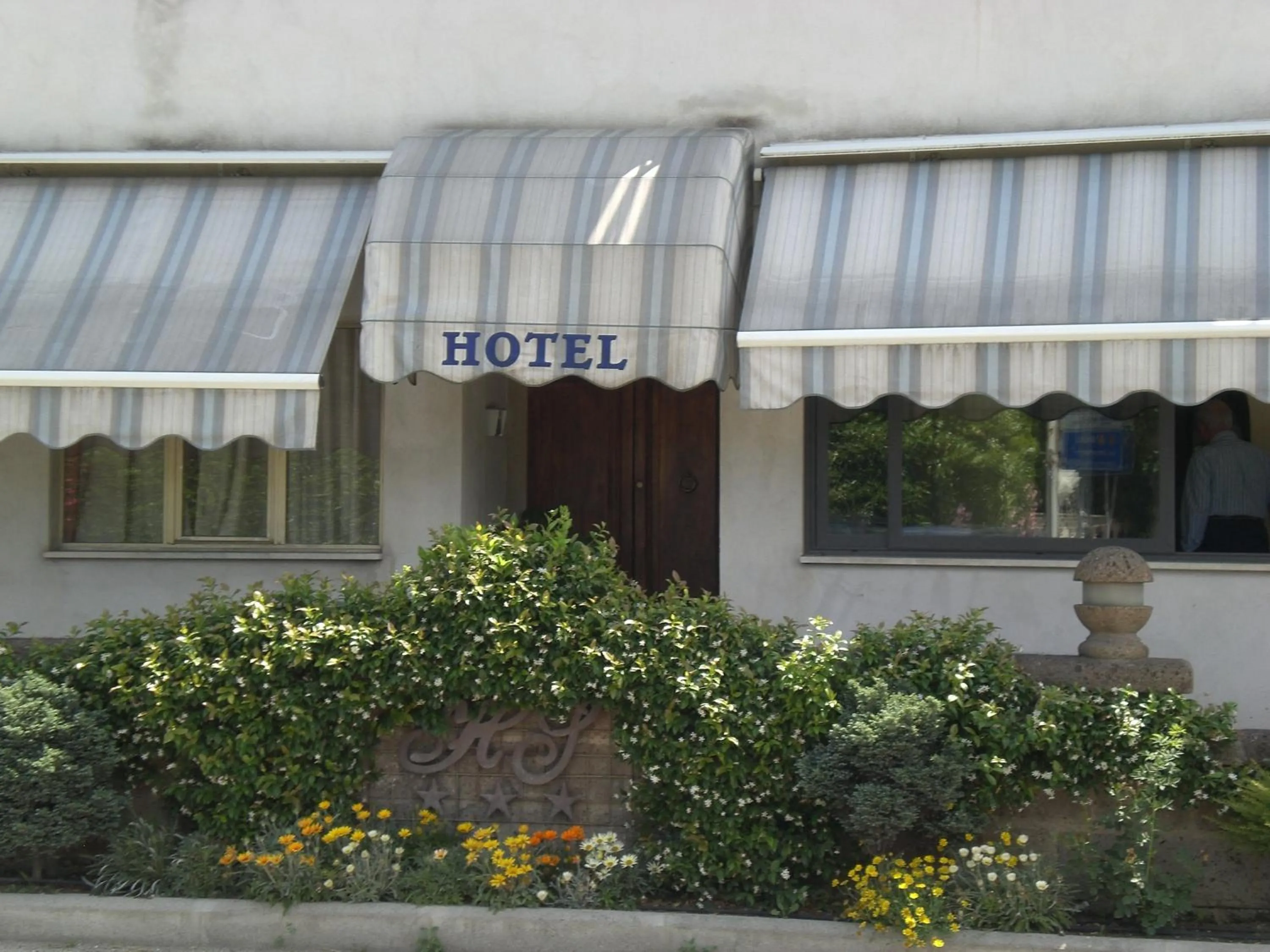 Property logo or sign in Hotel Sassacci