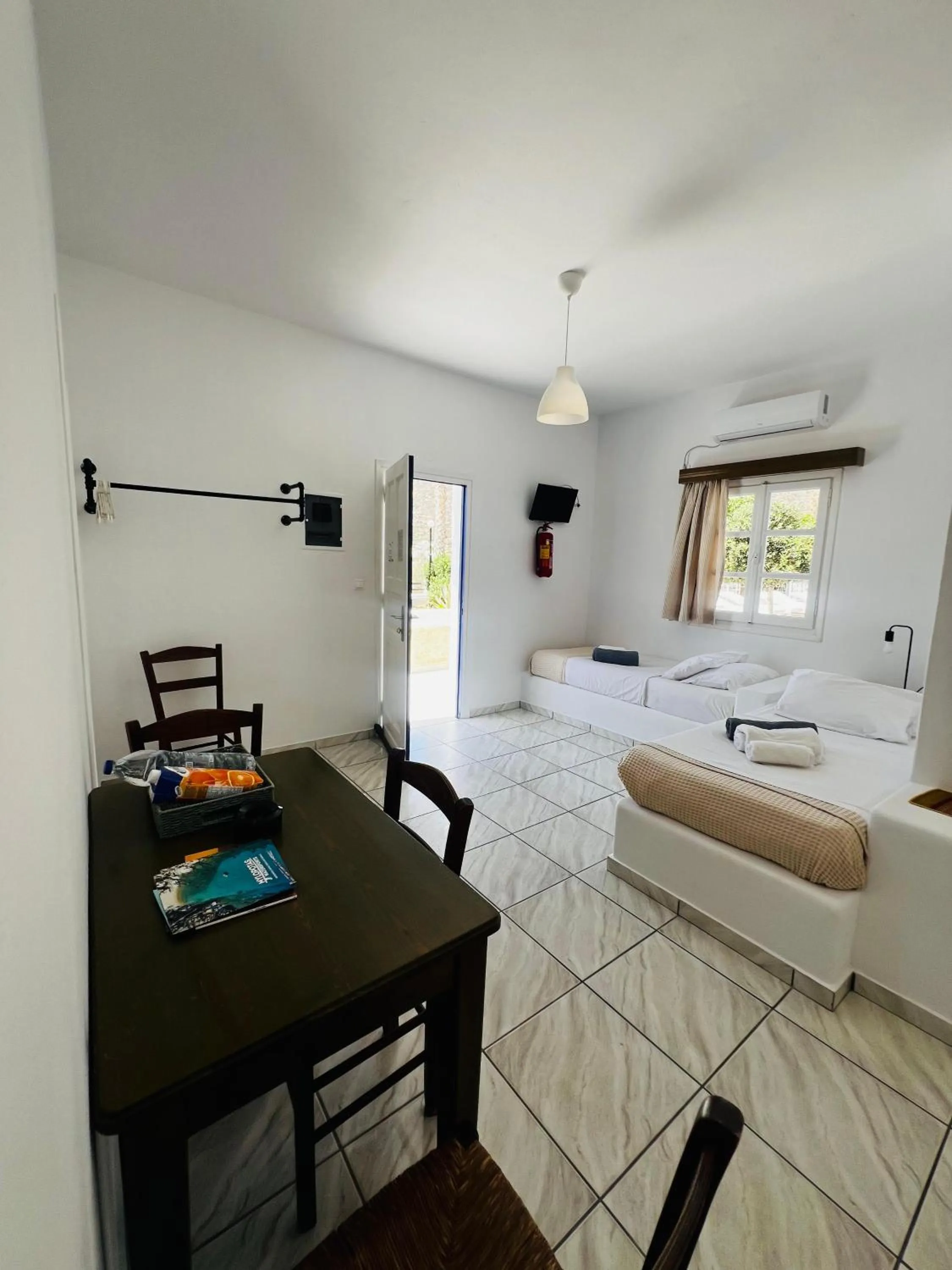 Bed in Paradise Apartments Studios