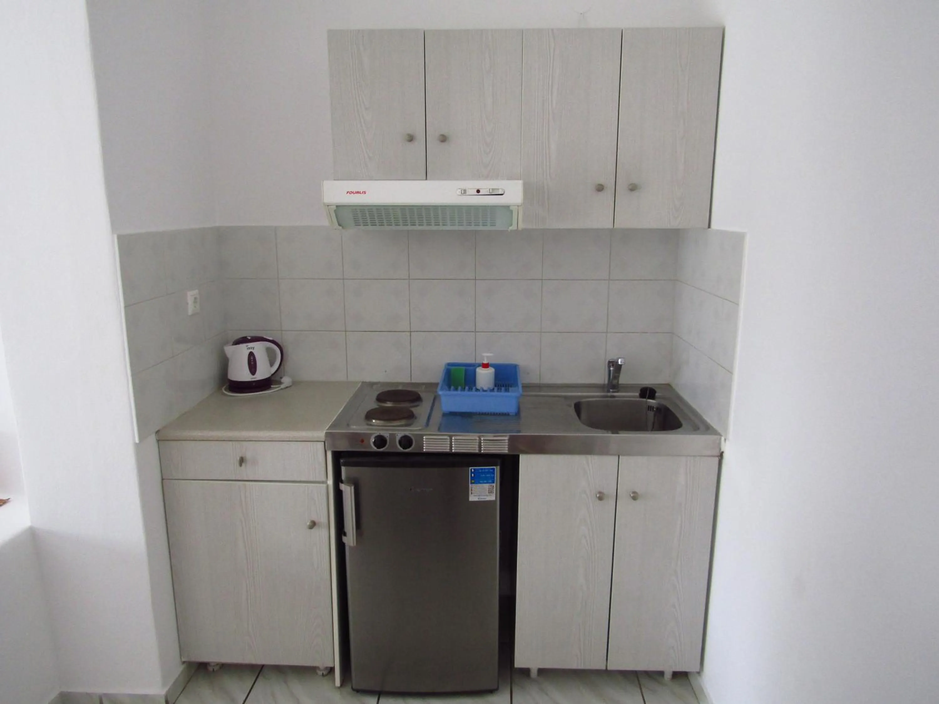 Kitchen or kitchenette in Paradise Apartments Studios