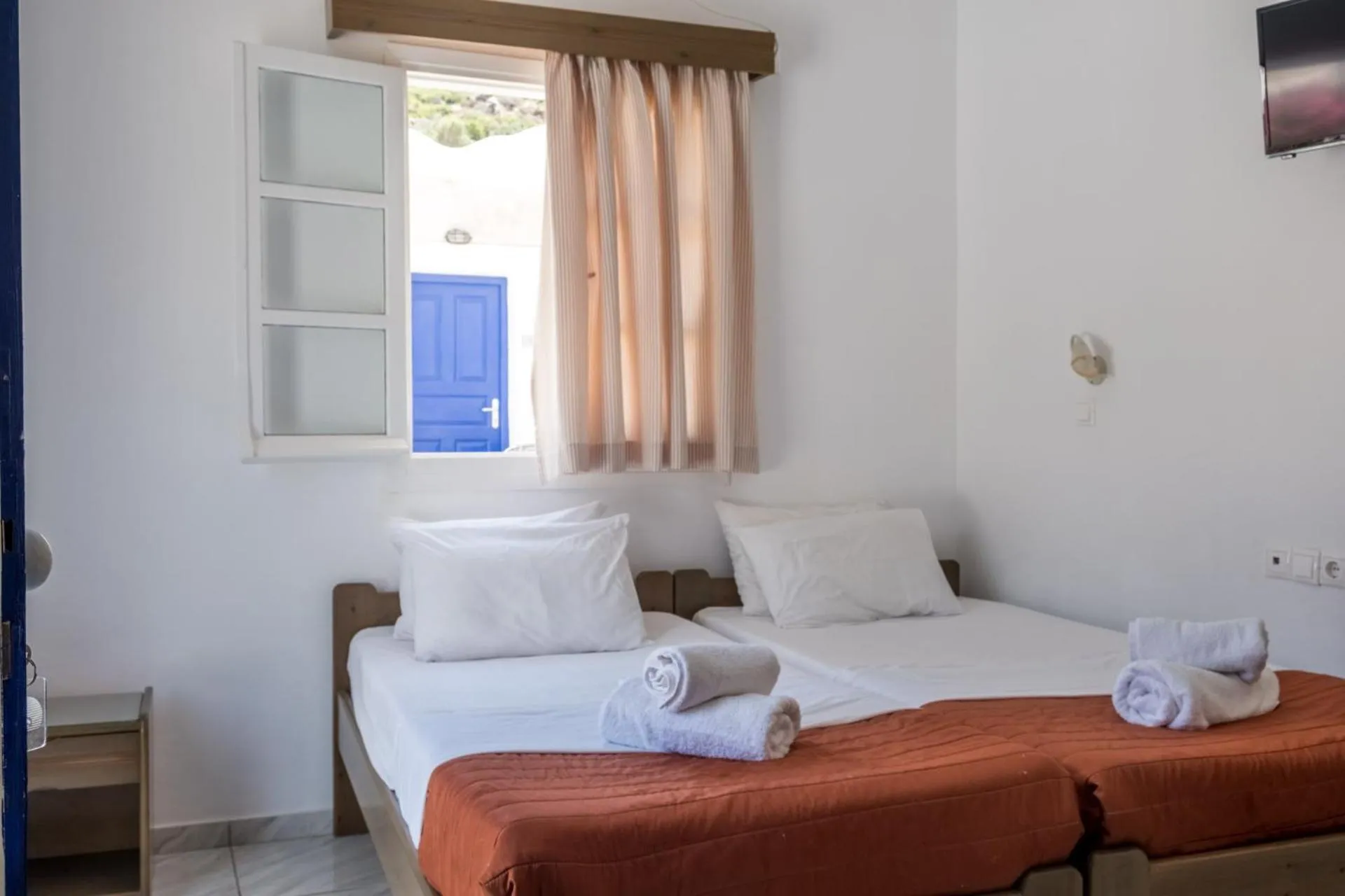 Bed in Paradise Apartments Studios