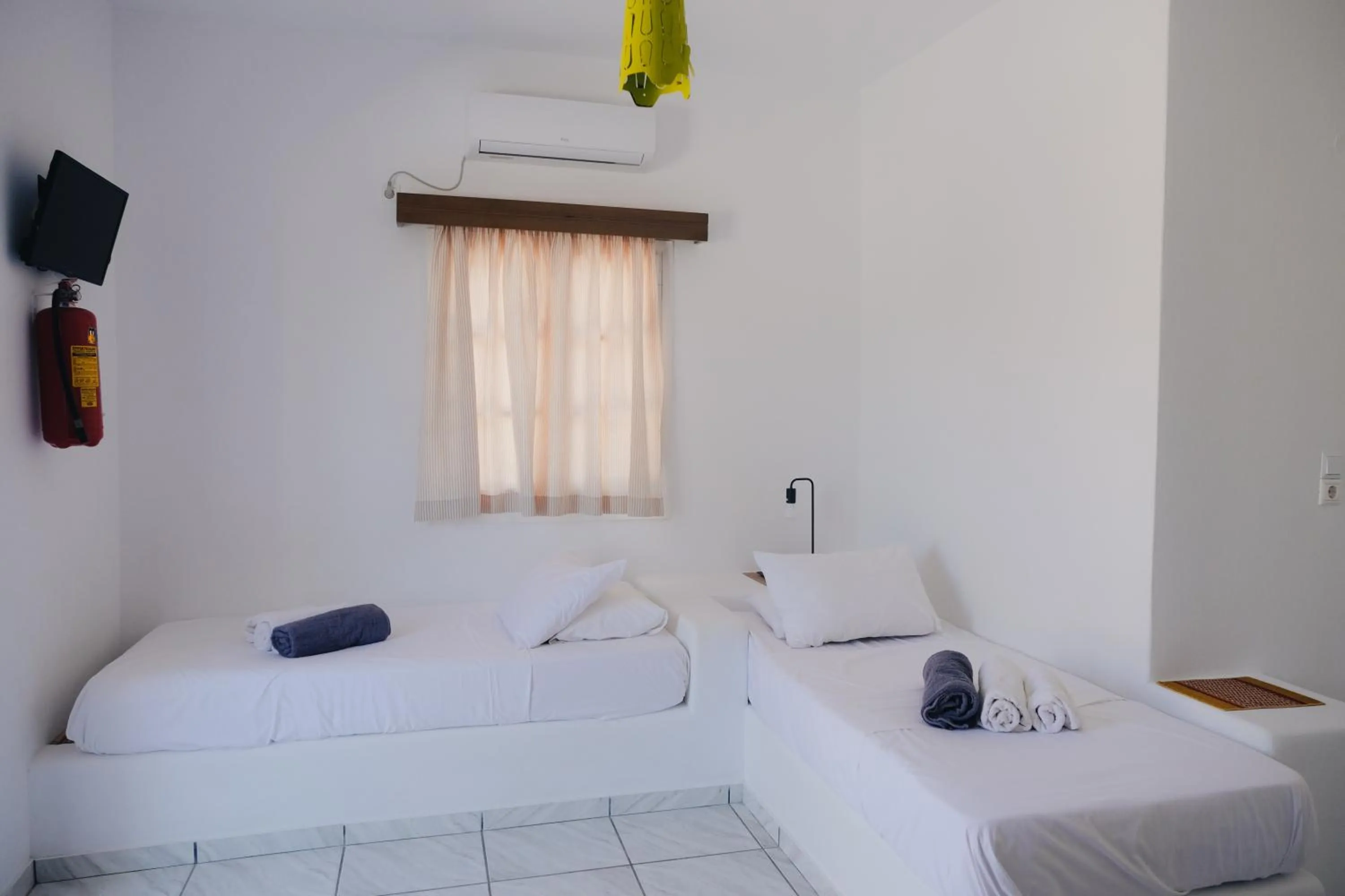 Bed in Paradise Apartments Studios