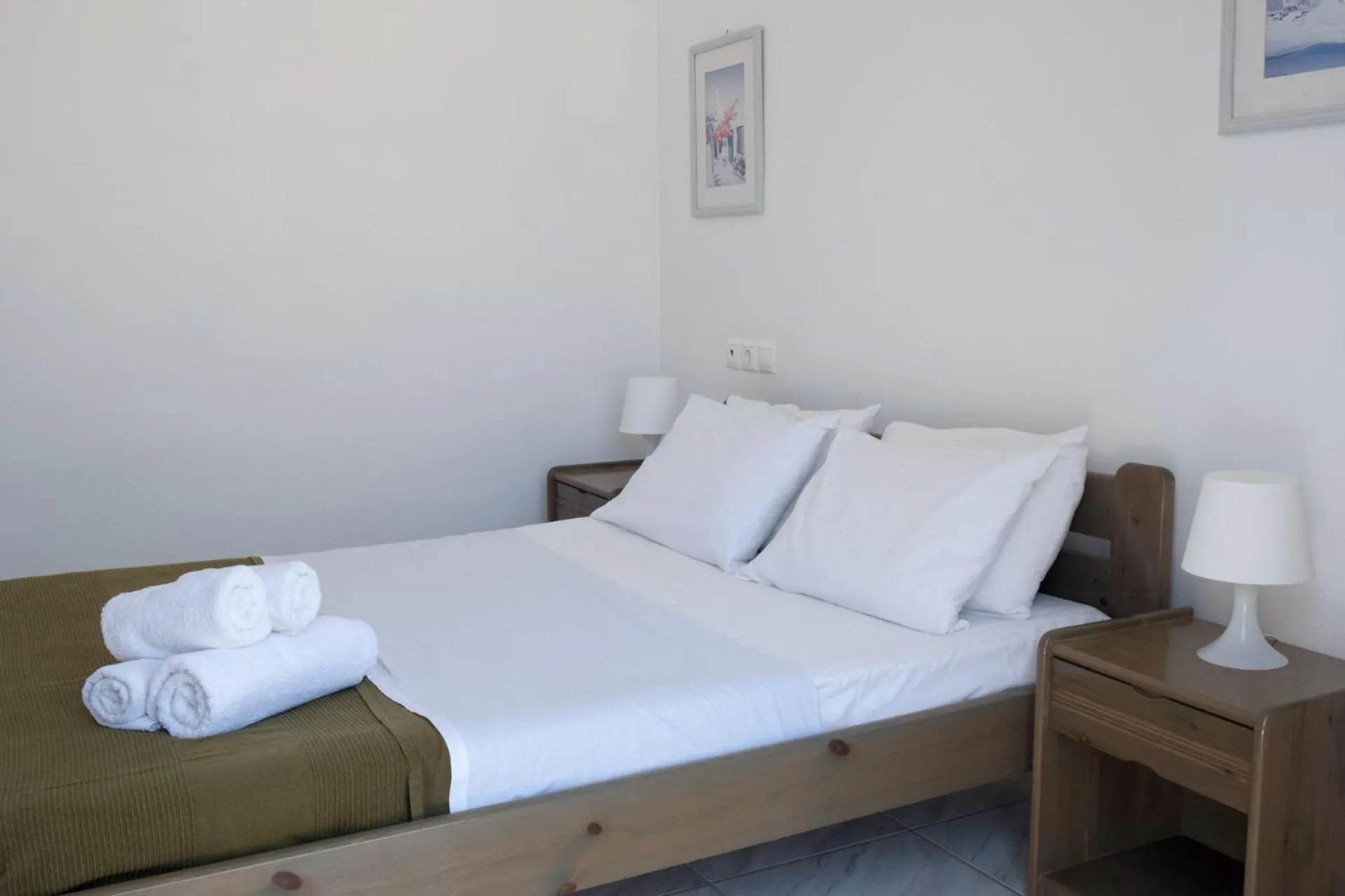 Bed in Paradise Apartments Studios