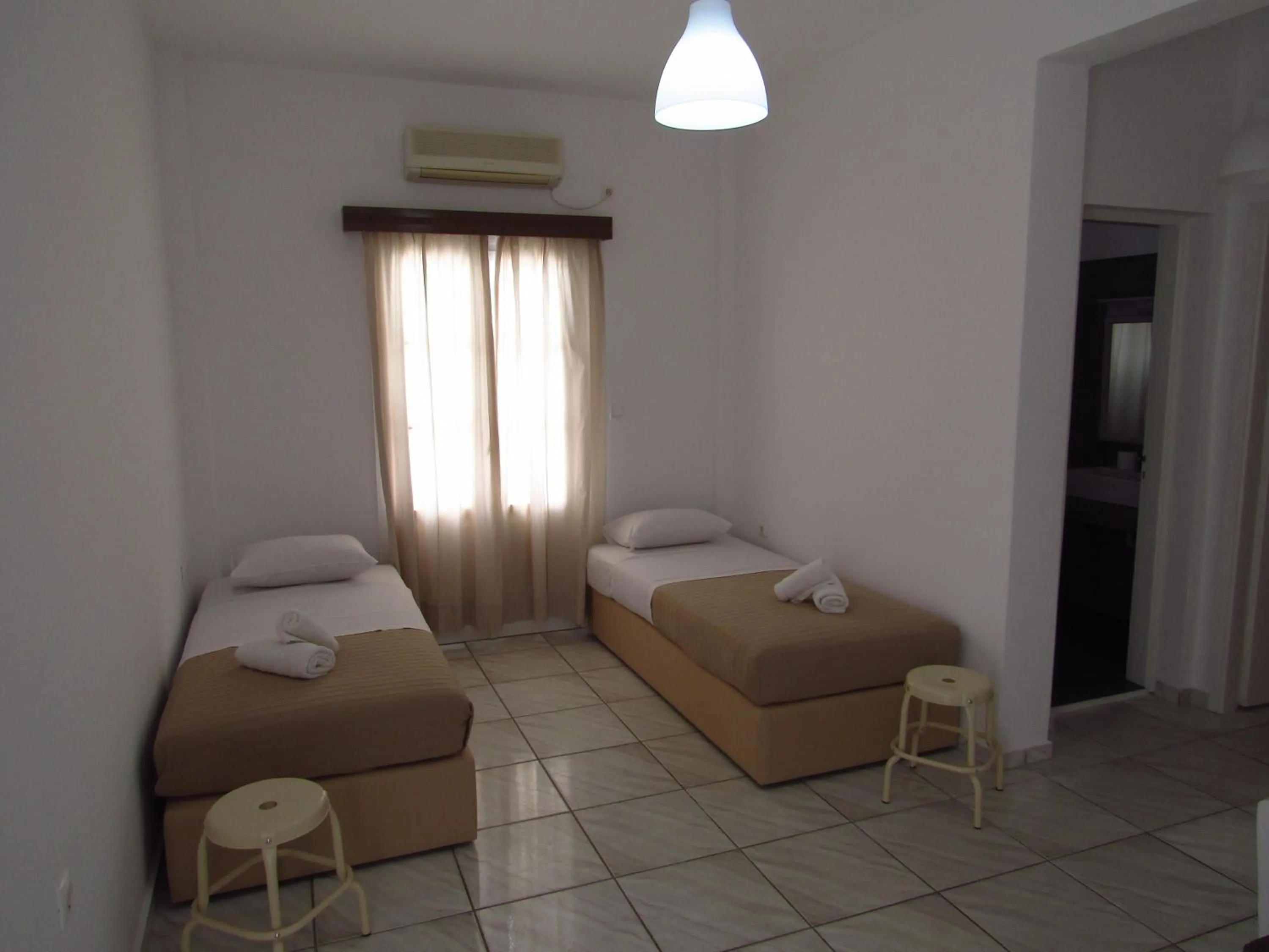 Living room, Bed in Paradise Apartments Studios