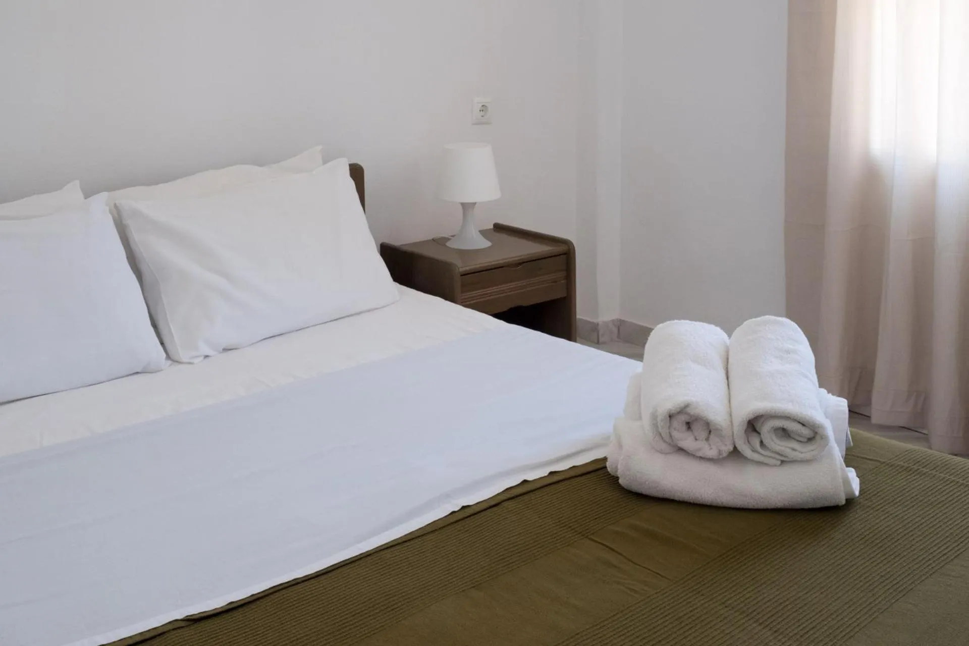 Bed in Paradise Apartments Studios