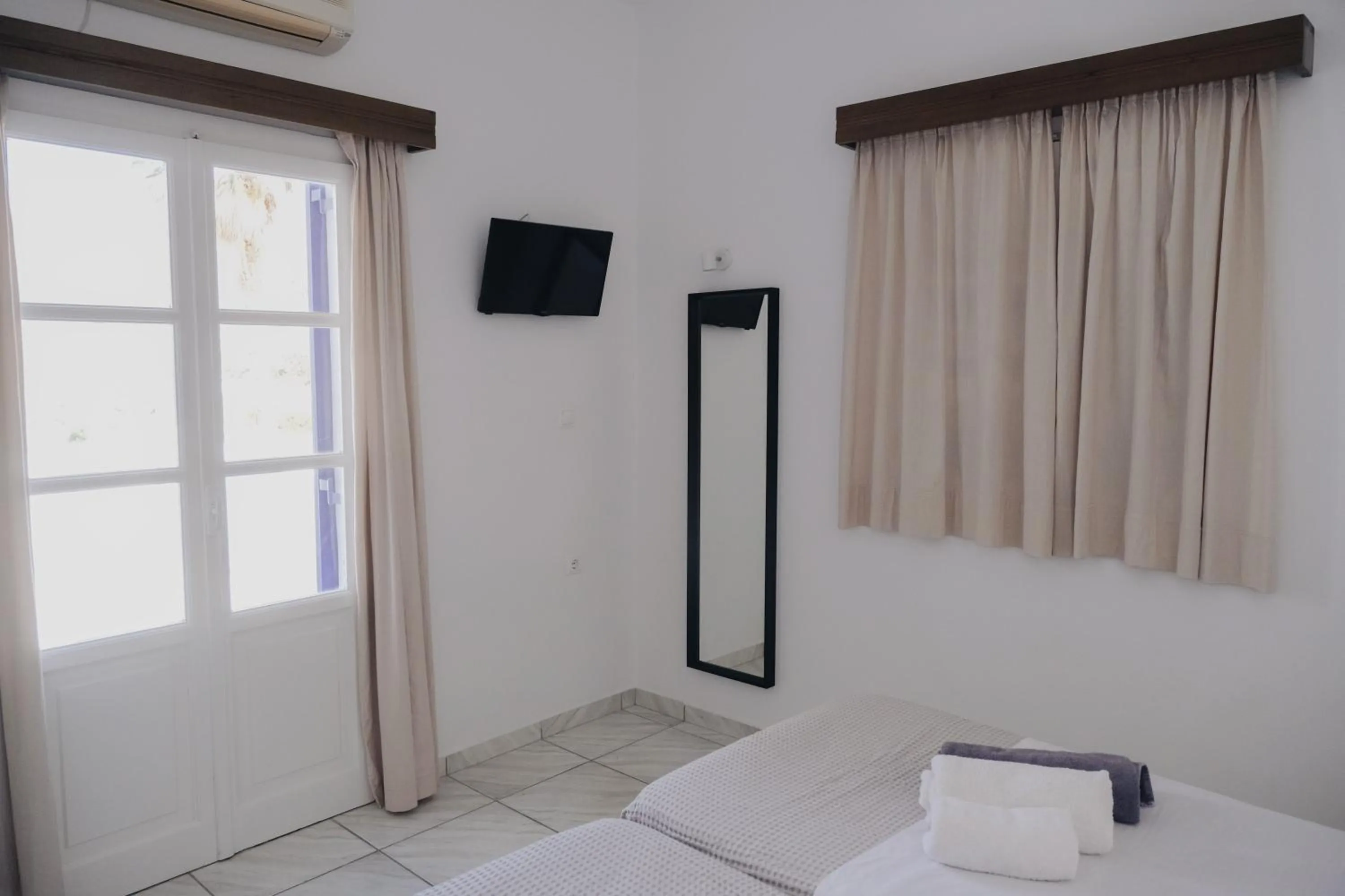 Bed in Paradise Apartments Studios