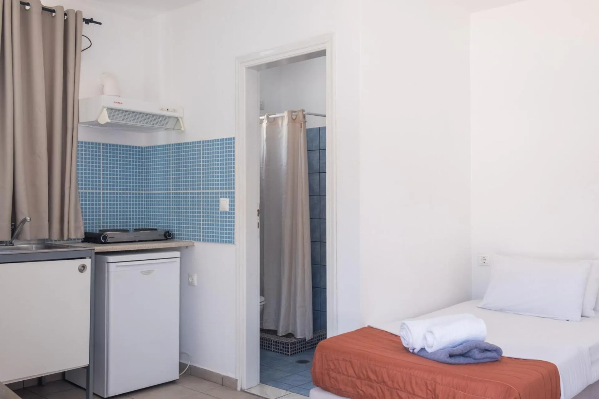 Bed in Paradise Apartments Studios