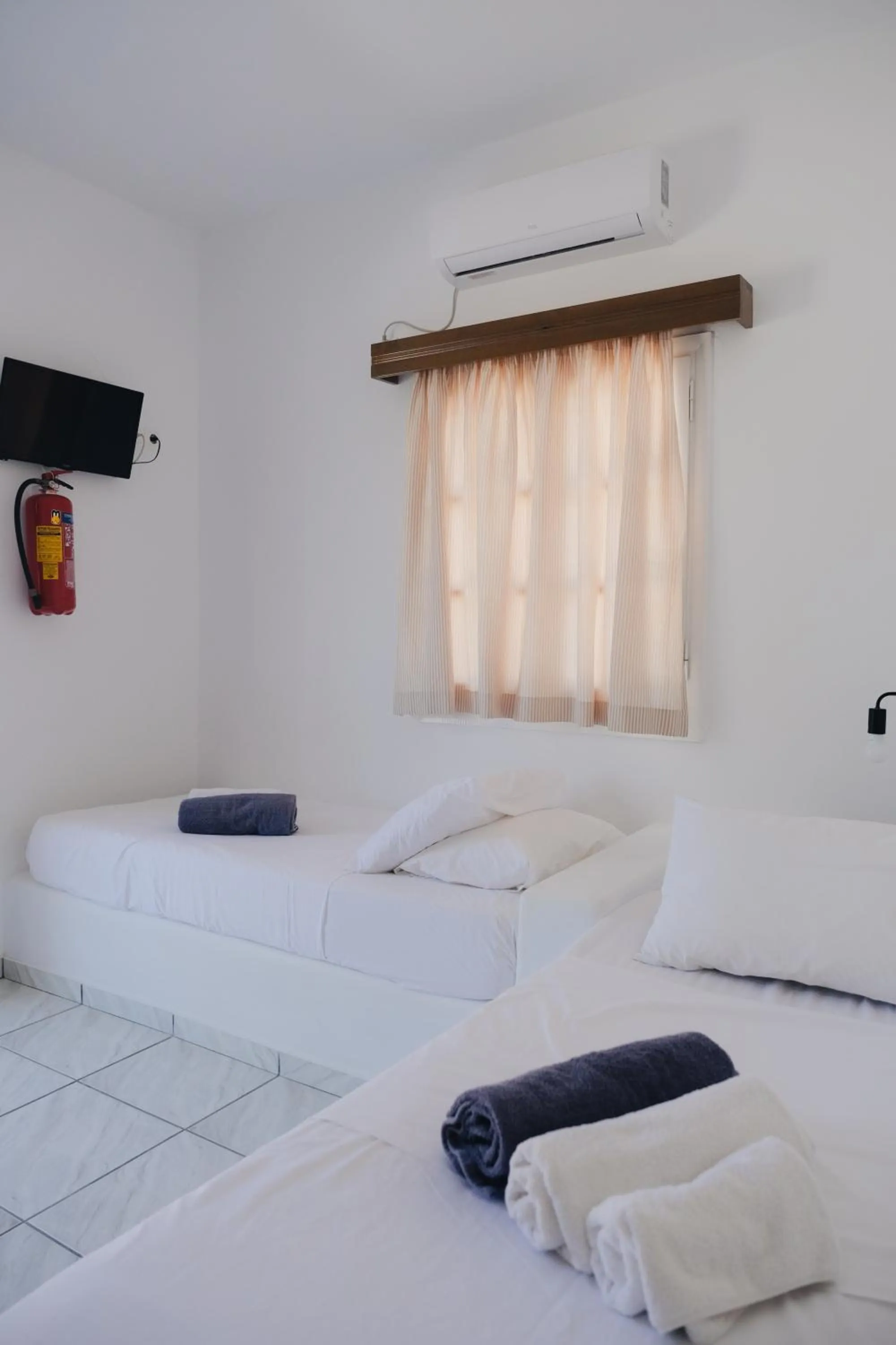 Bed in Paradise Apartments Studios