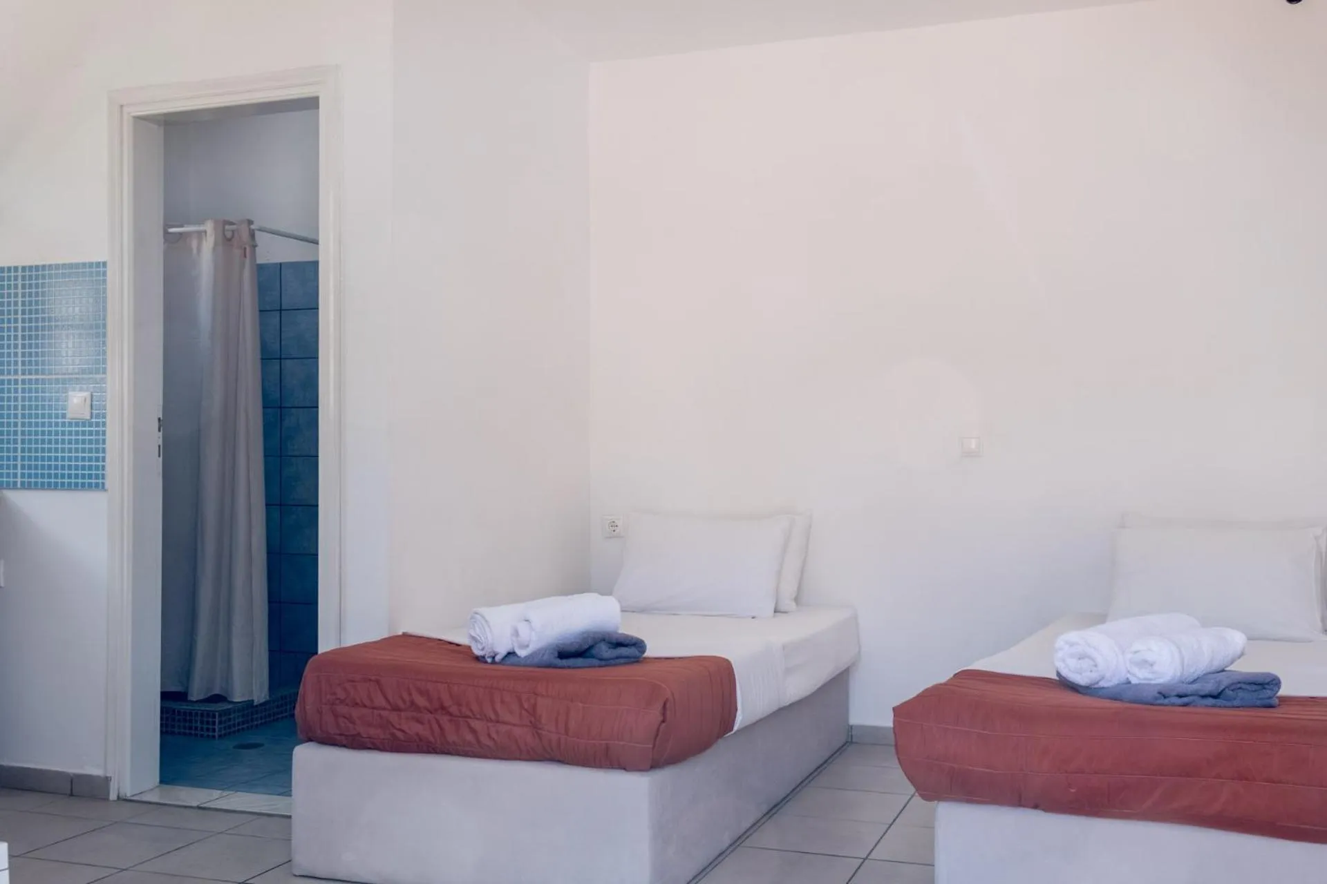 Bed in Paradise Apartments Studios