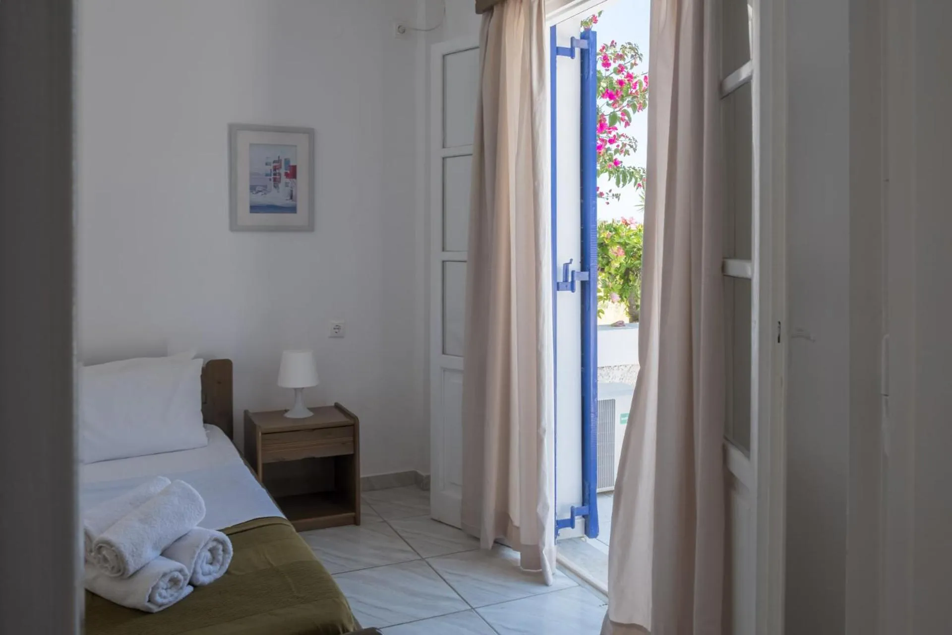 Bed in Paradise Apartments Studios