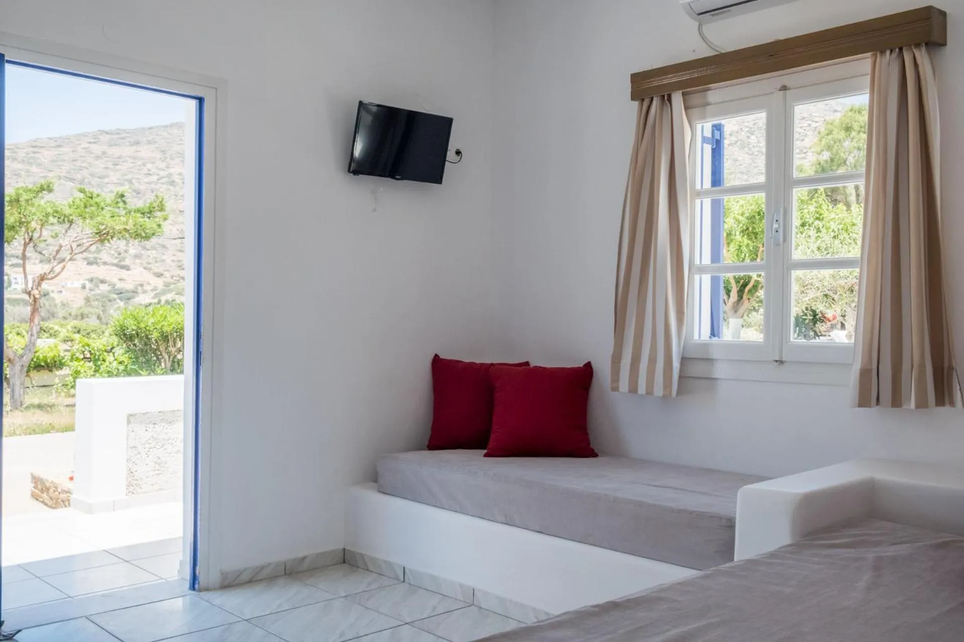 Bed in Paradise Apartments Studios