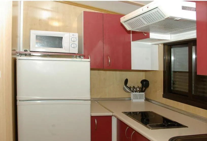 Kitchen or kitchenette in Bungalows Granja Escuela Arlanzón