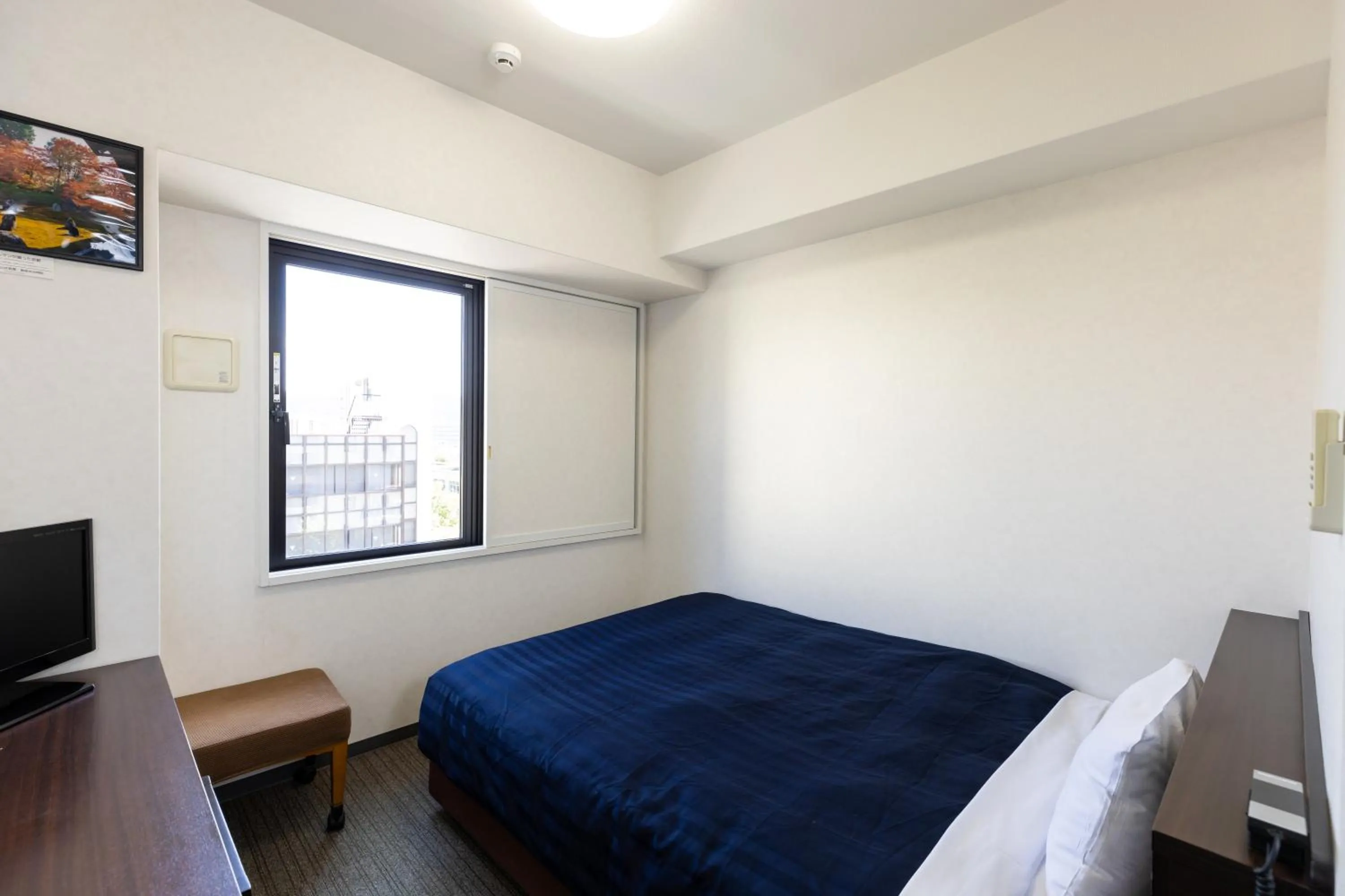 Bed in Kyoto Plaza Hotel