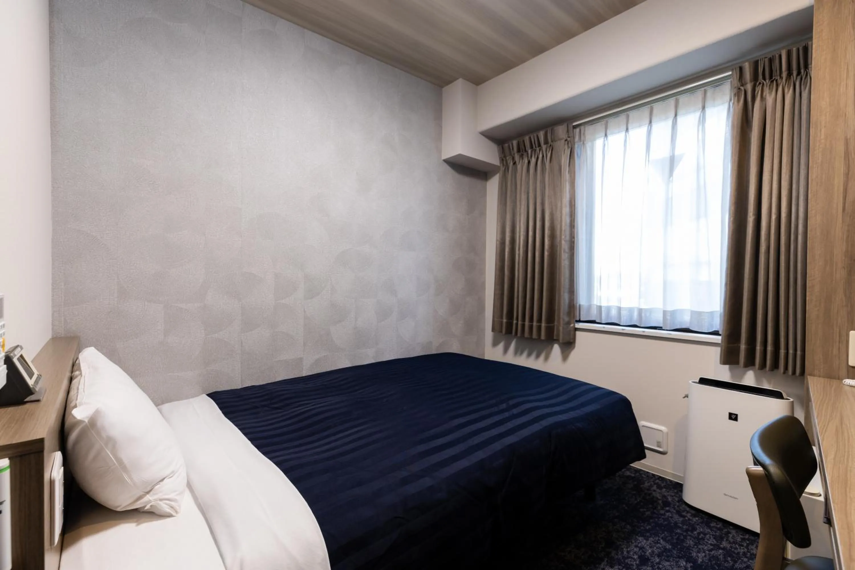 Bed in Kyoto Plaza Hotel